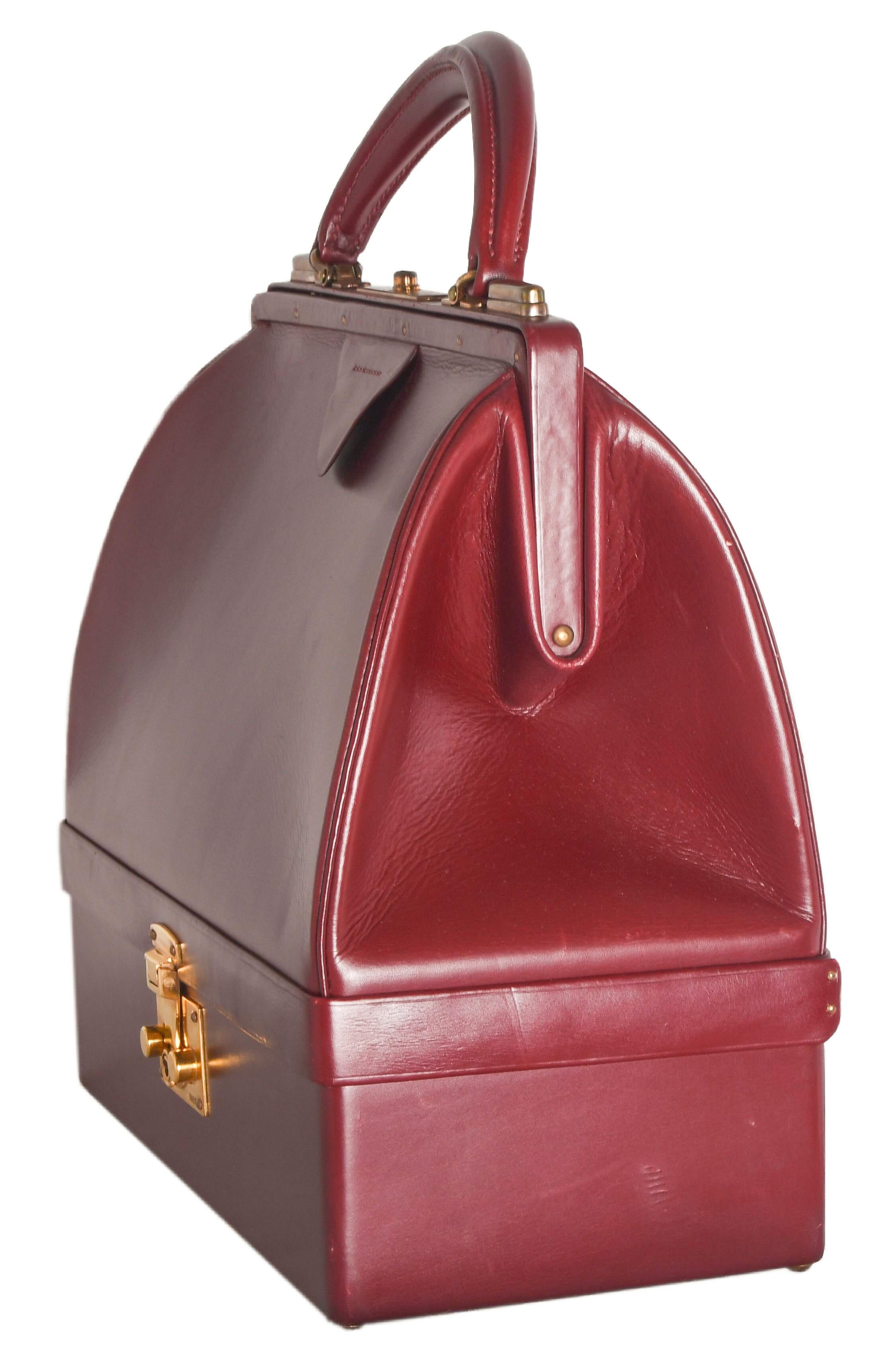 Hermes Vintage Sac Mallette was originally designed as a travel case during the Roaring '20s.  Now it doubles as a sophisticated handbag with purpose.  Quite rare, this exceptionally stunning piece is a must have for collectors. Glossy rouge box