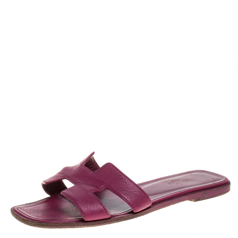 Put your best foot forward this season in these pretty Hermes sandals. These burgundy Oran sandals have been crafted from leather in Italy and they feature the iconic H on the vamps as well as insoles meant to provide comfort at every step. These