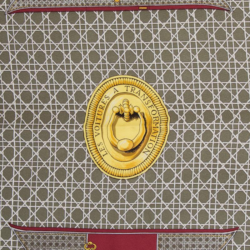 Hermes 'Les Voitures A Transformation 90' scarf designed by Francoise de la Perriere in burgundy, white, yellow, black, pink, grey and olive green silk twill (100%). Has been worn and is in excellent condition.

Width 90cm (35.1in)
Height 90cm