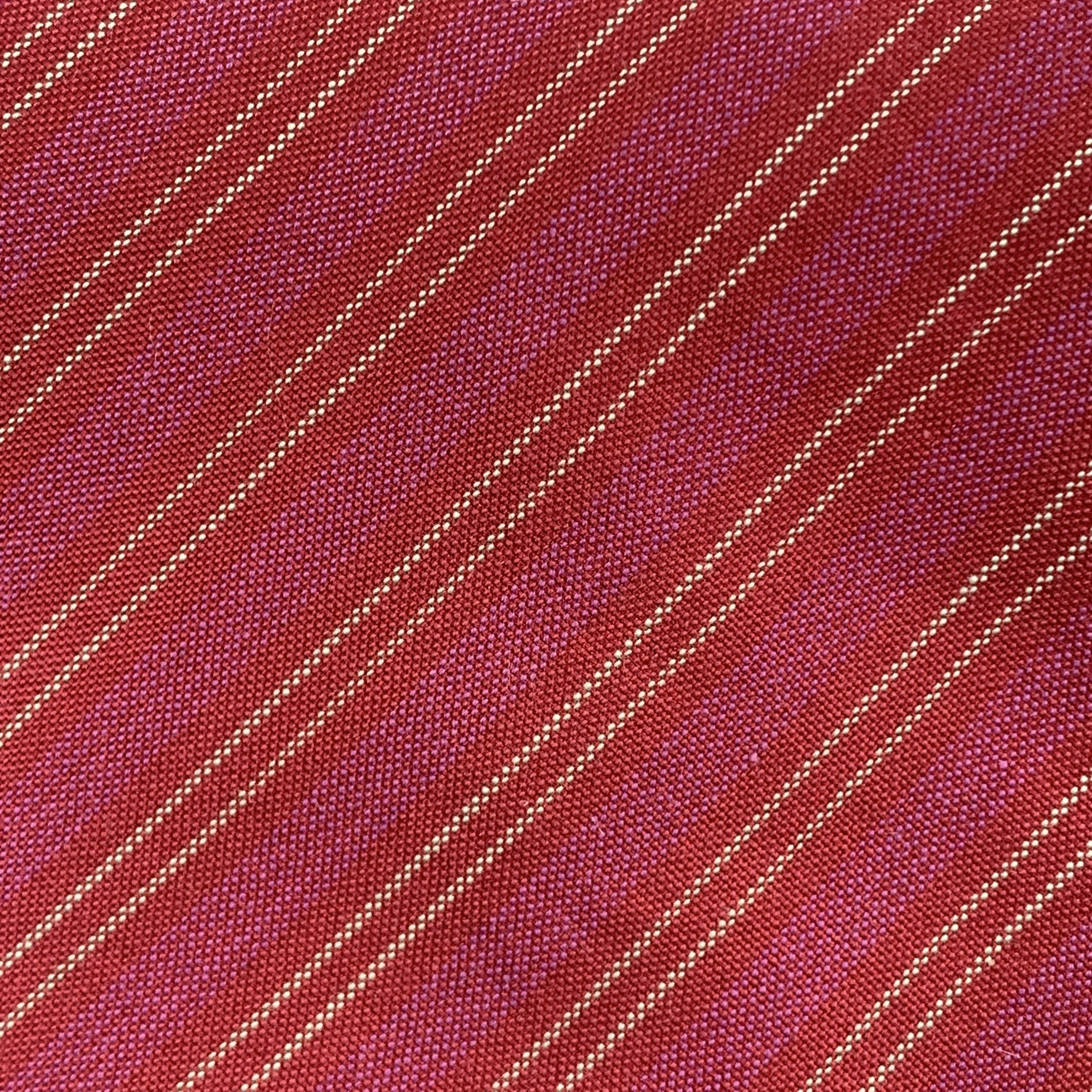 HERMES necktie comes in raspberry woven silk with all over red diagonal stripe print. Made in France.

Excellent Pre-Owned Condition.

Width: 3.5 in. 