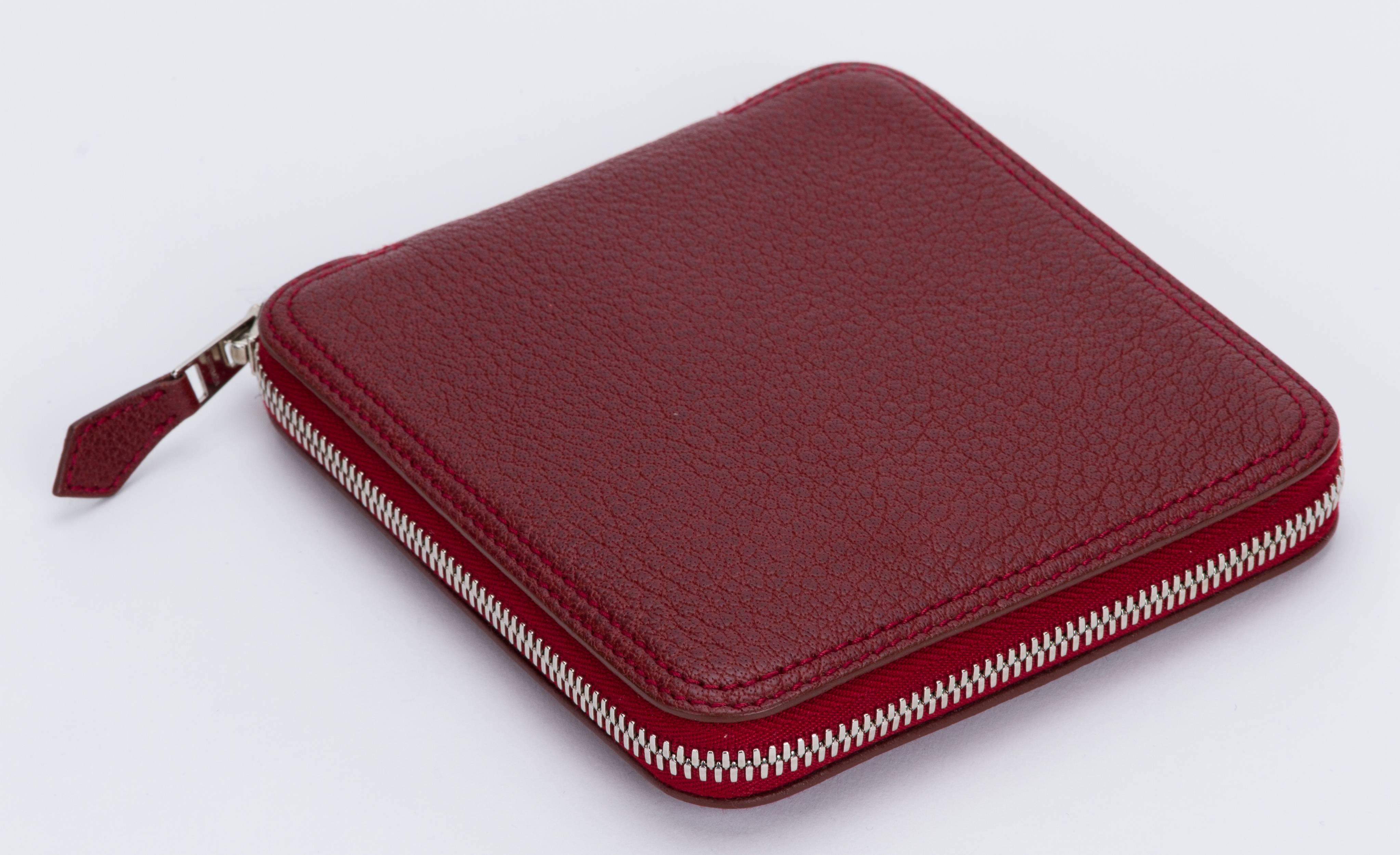 Hermès burgundy leather and multipattern silk foldable bag. Excellent condition. Closed measurements 5