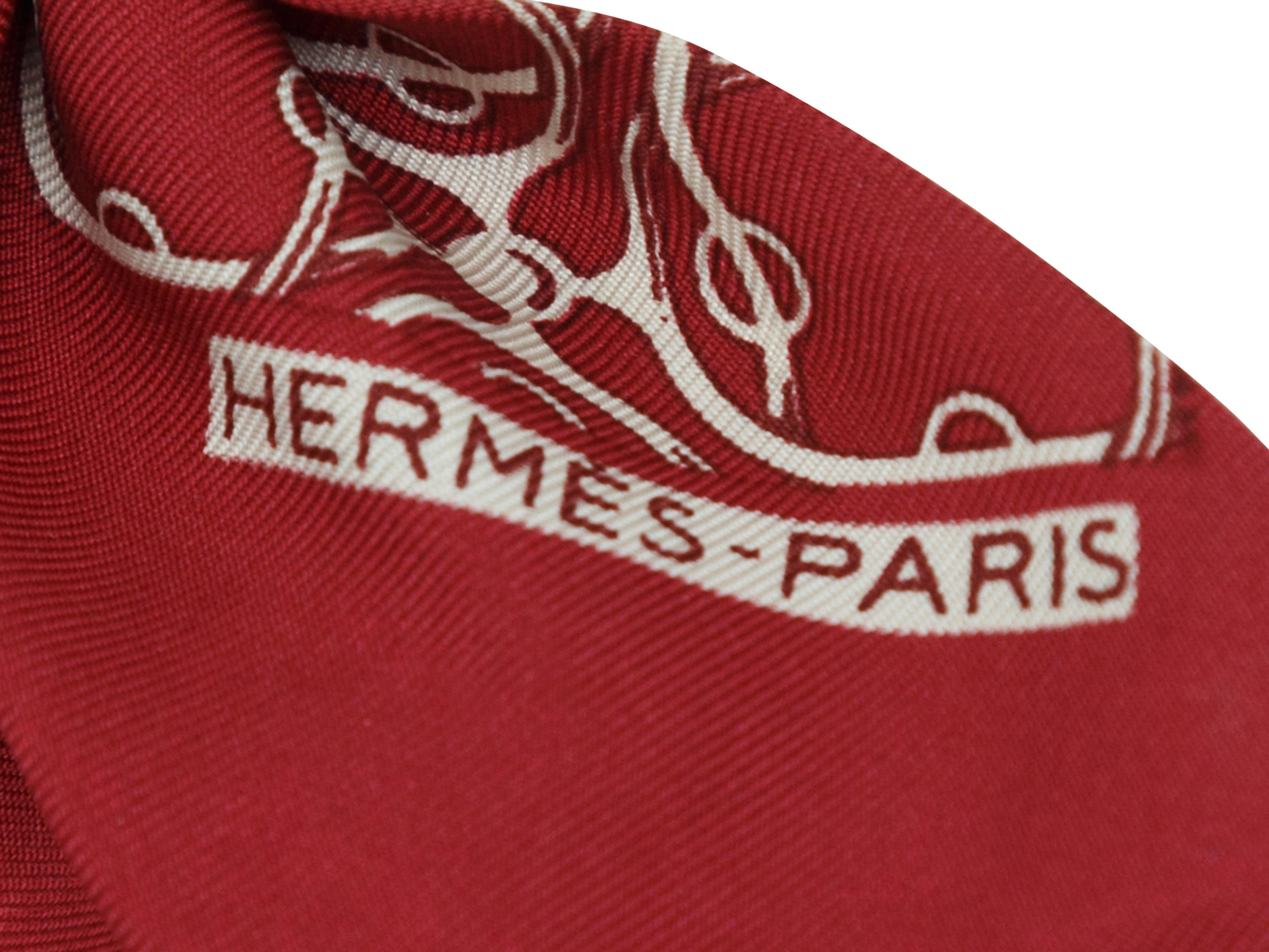 Product details: Burgundy and white neck tie scarf by Hermes. Abstract print throughout. 25.5