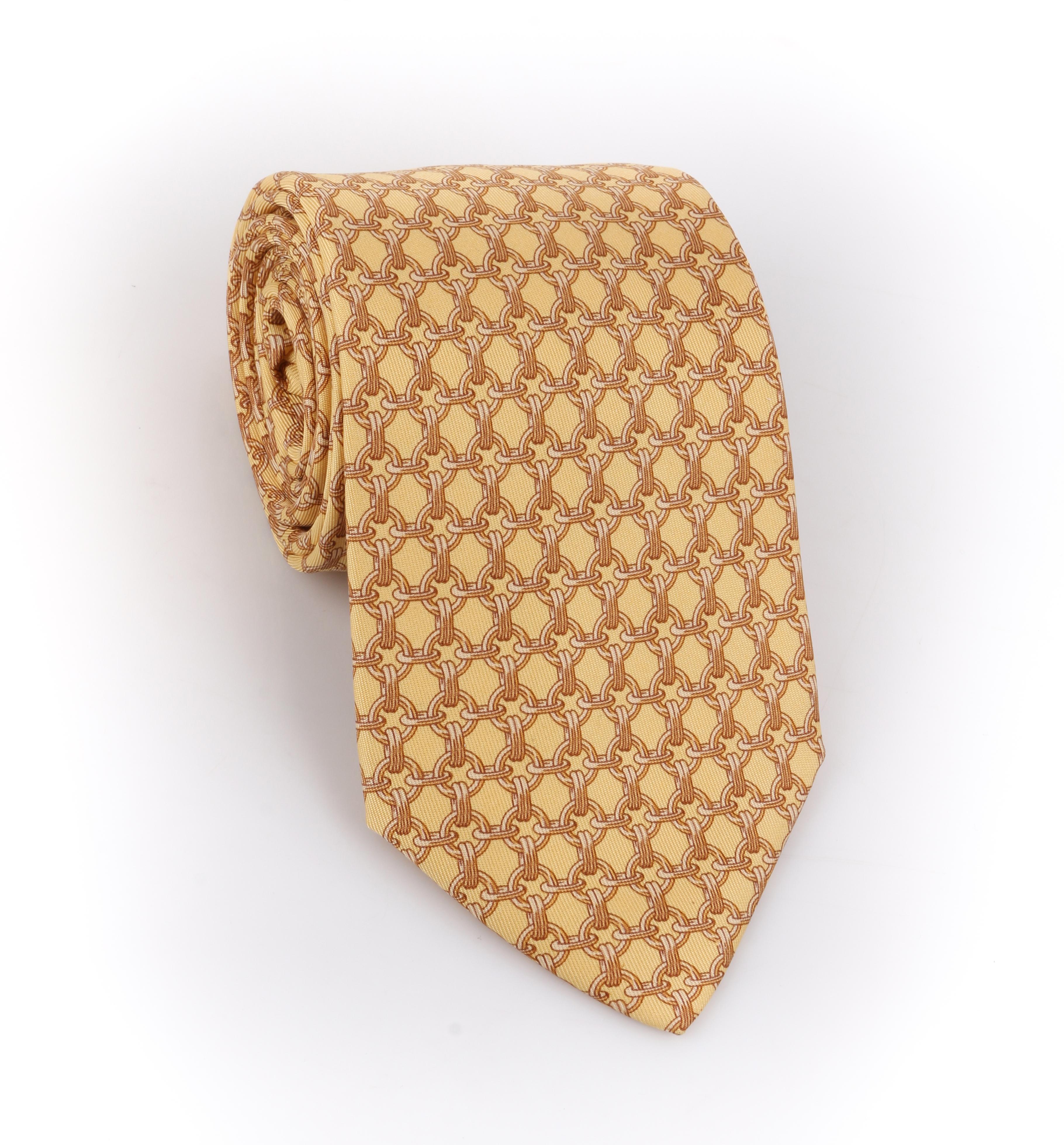 DESCRIPTION: HERMES Butter Yellow Chain Link Print 5 Fold Silk Necktie Tie 59 EA
 
Brand / Manufacturer: Hermes
Style: 5 fold necktie
Color(s): Shades of yellow and gold
Lined: Yes
Marked Fabric Content: 100% Silk
Additional Details / Inclusions:
