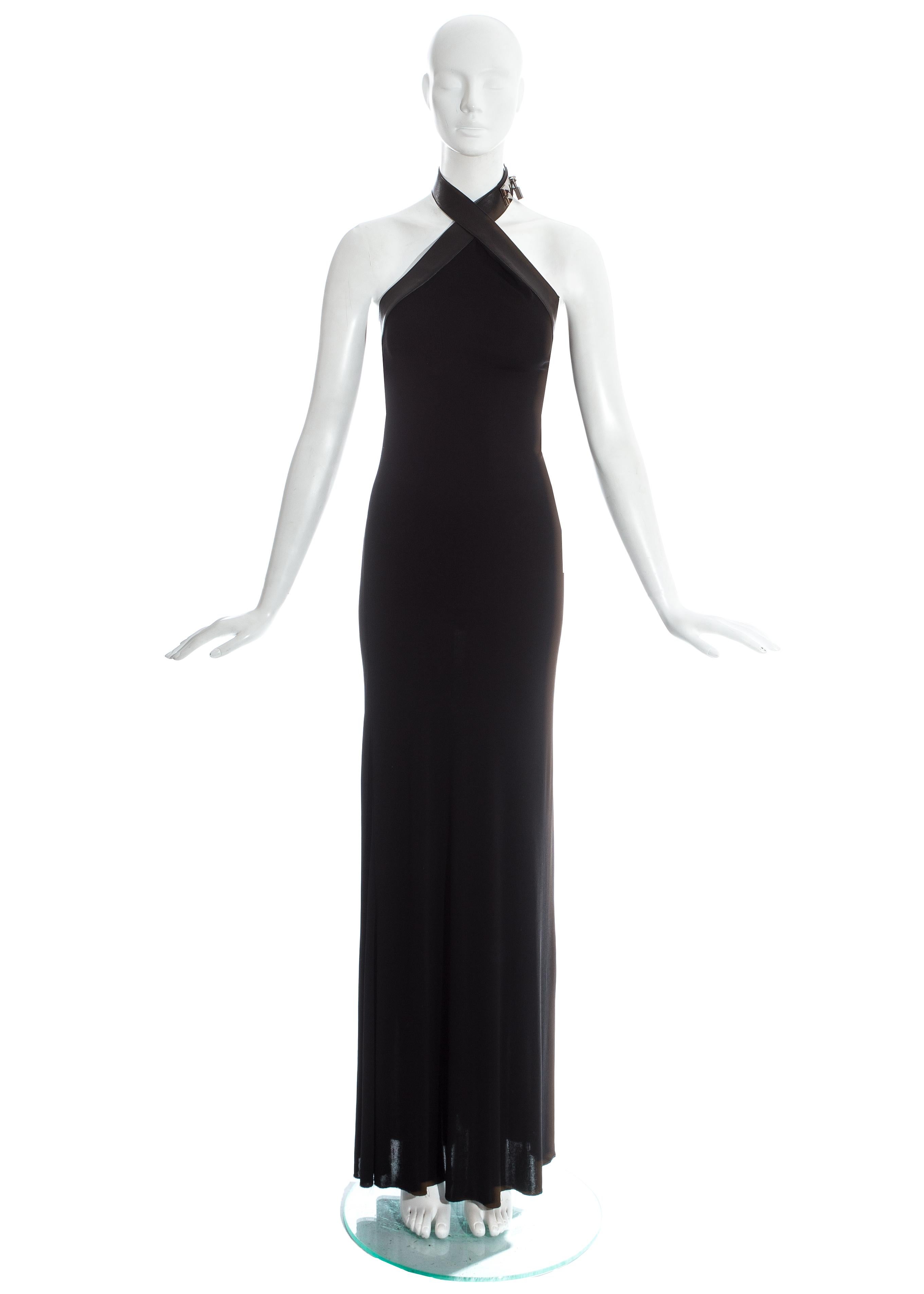 Hermes by Jean Paul Gaultier; black silk jersey evening maxi dress with black lambskin leather halter neck strap with 'Collier de chien' silver closure and padlock. 

Fall-Winter 2009