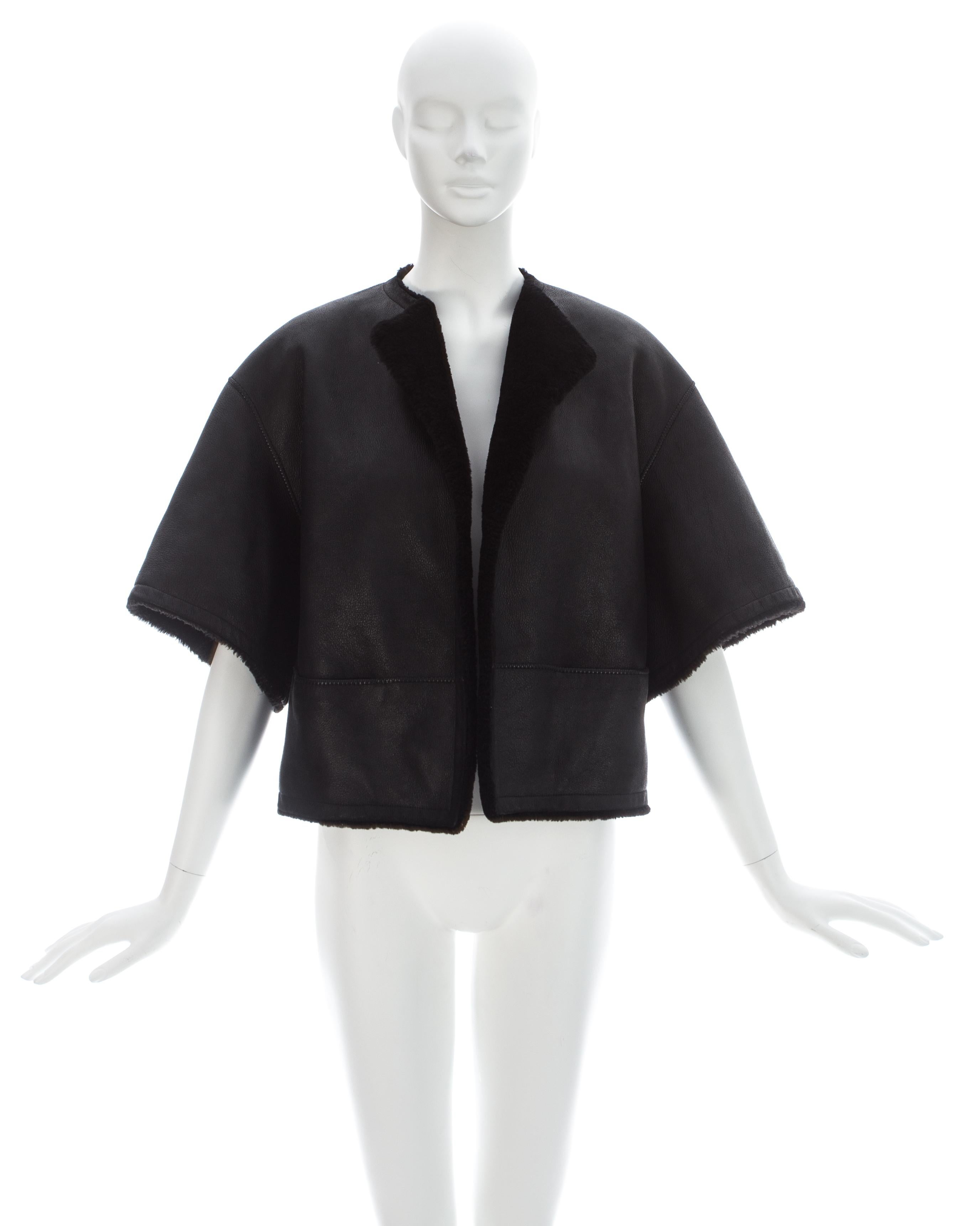 Hermes by Martin Margiela; Black shearling leather cropped jacket with wide cut sleeves and two front pockets 

Fall-Winter 2002