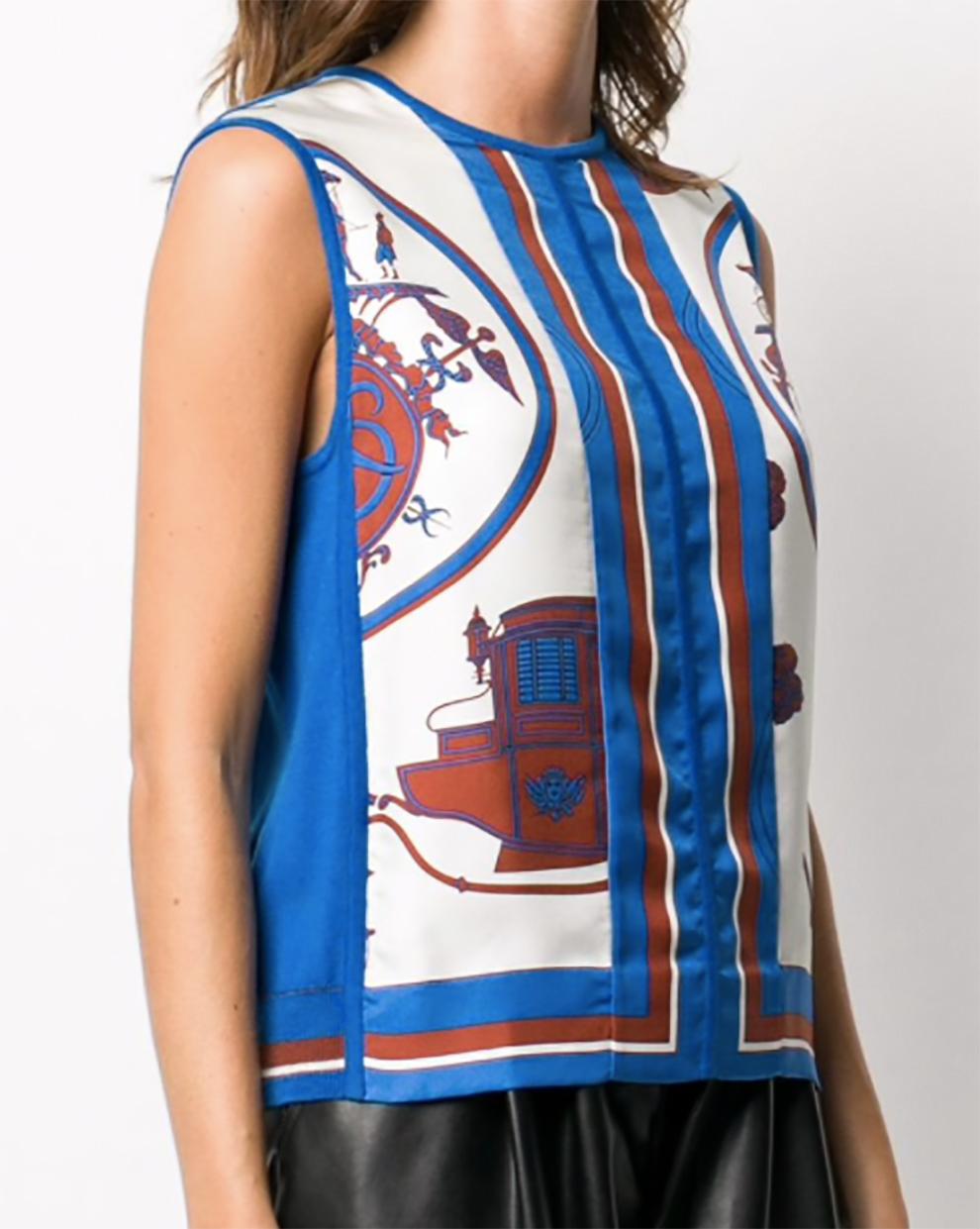 Hermes by Martin Margiela blue silk, wool & cashmere sleeveless top featuring a front 100% silk print motive. 
Front 100% silk 
Back:70% wool, 30%cashmere.. 
Estimated size 36fr/ US4/ UK8
In excellent  vintage condition. Made in France.
Shoulder to