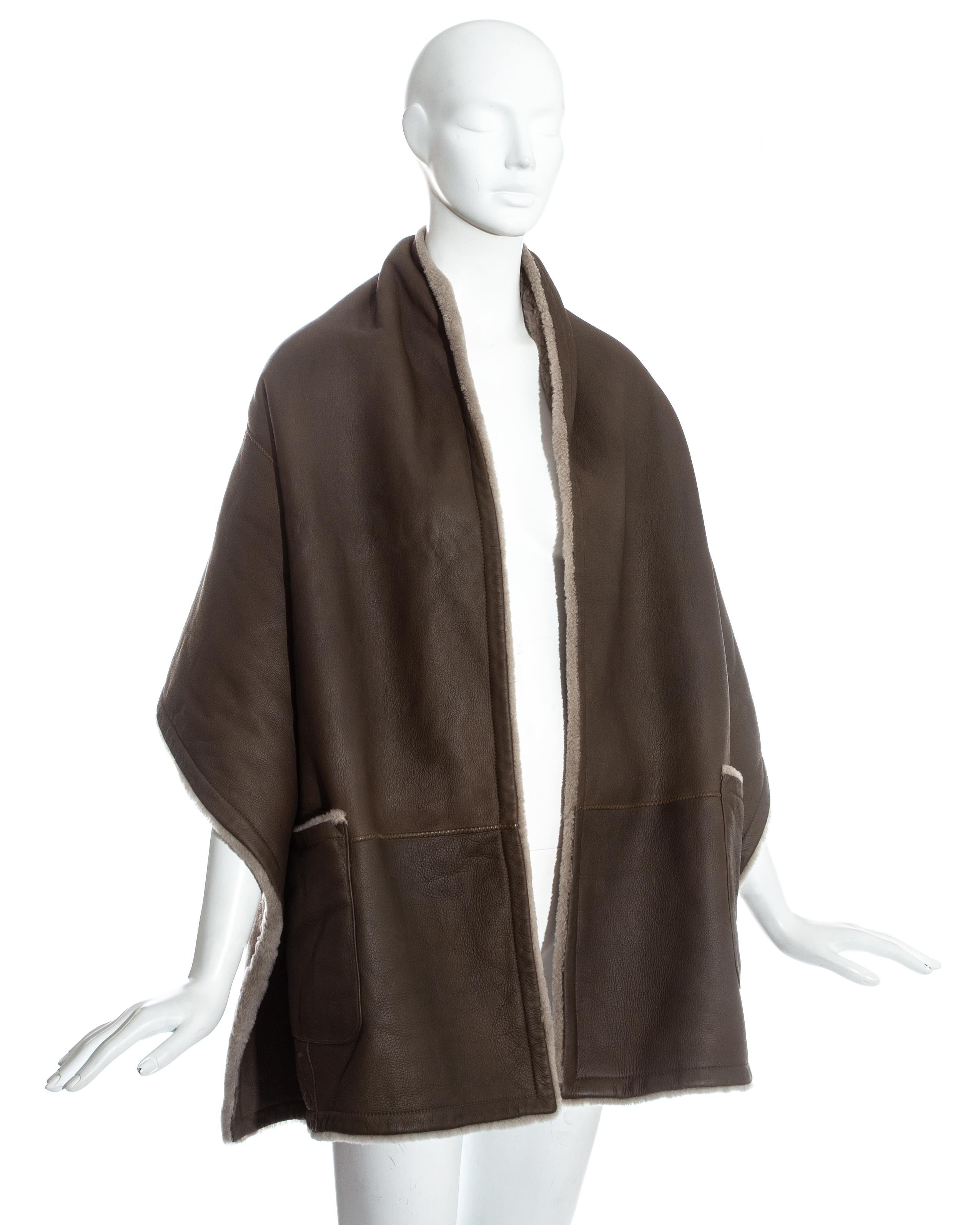 Hermes by Martin Margiela; mushroom shearling lambskin leather reversible stole. Two front patch pockets. 

Fall-Winter 1999