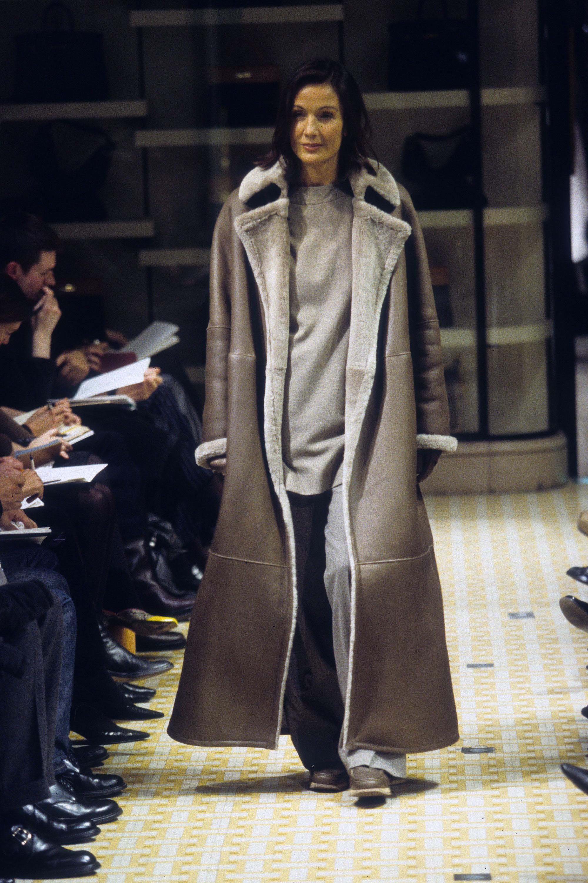 ▪ Hermes grey shearling maxi coat 
▪ Designed by Martin Margiela 
▪ Open front 
▪ Reversible design 
▪ Large notched lapels 
▪ Open patch pockets on both sides 
▪ Loose fit 
▪ Sizing flexible; small - medium 
▪ Fall-Winter 1999