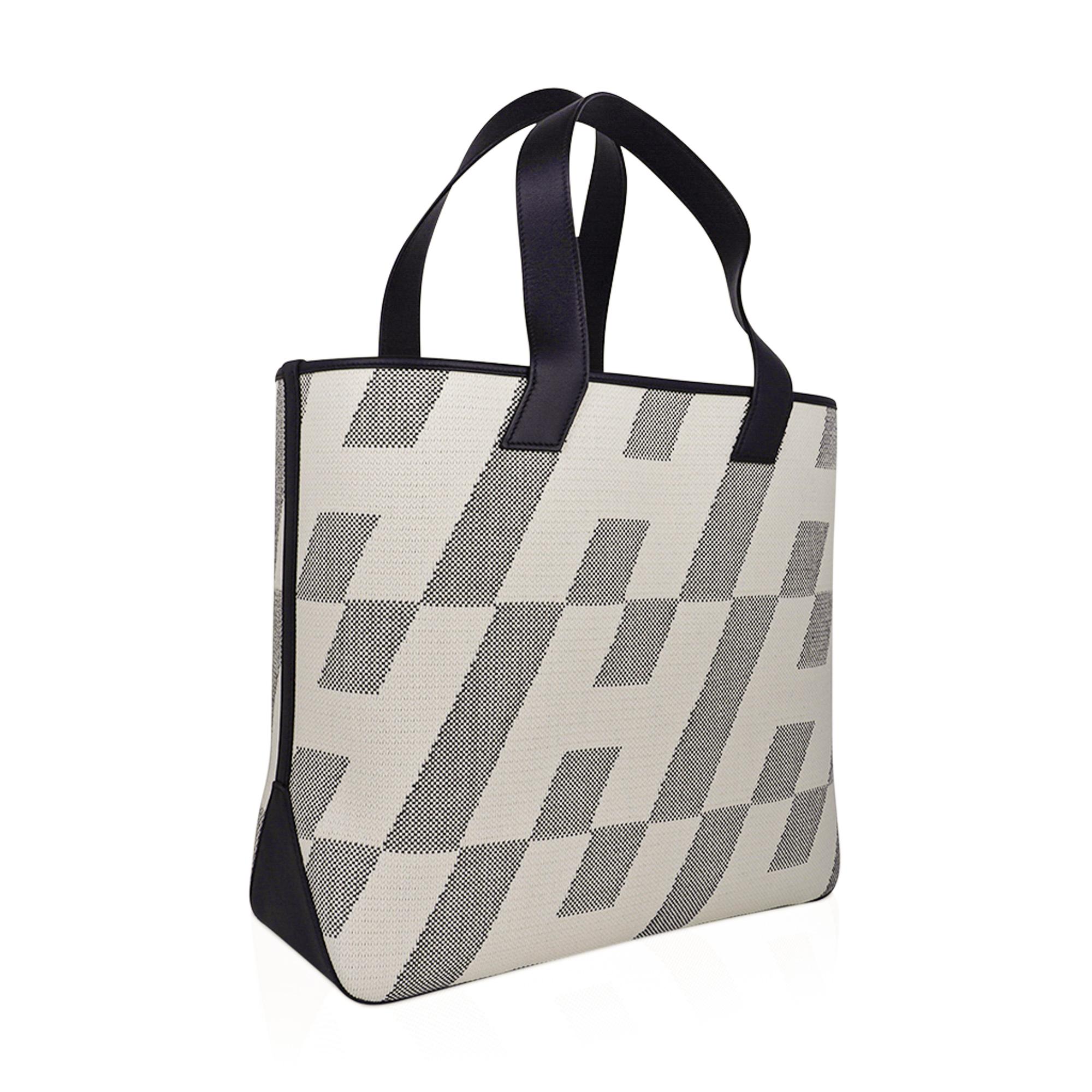 Mightychic offers an Hermes Cabas H En Biais Tote 40 bag featured in Black and Ecru.
Black Swift leather trim.
Lightweight and feminine this Hermes tote bag is the perfect go to summer bag.
Inspired by a 1970 design.
Durable and strong canvas