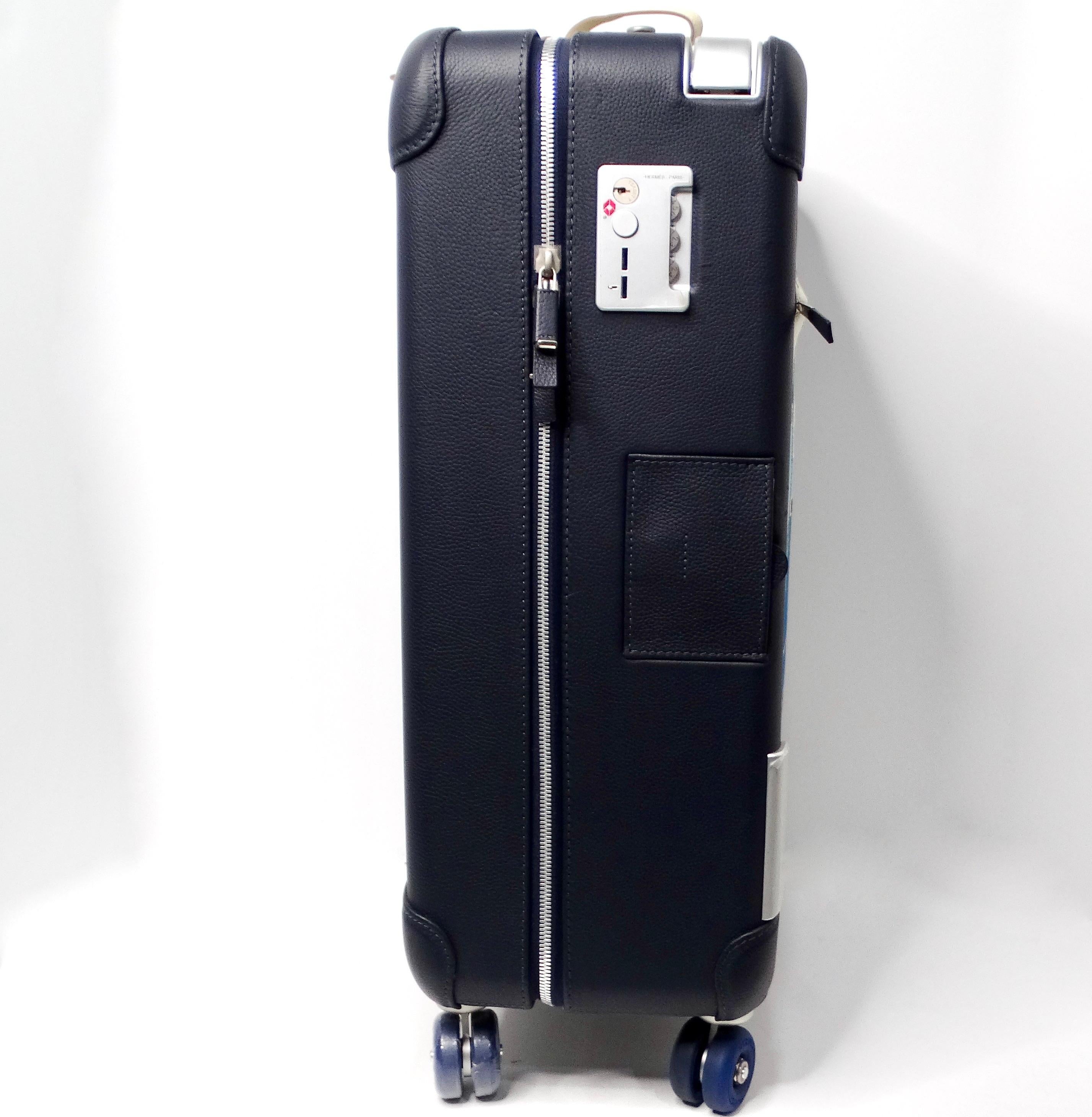The Hermes Cabine 55 Surfer Rolling Mobility Suitcase is an exquisite piece that combines functionality with high-fashion aesthetics. Adorned with a vibrant print of surfboards set against a beach backdrop, this suitcase embodies the essence of