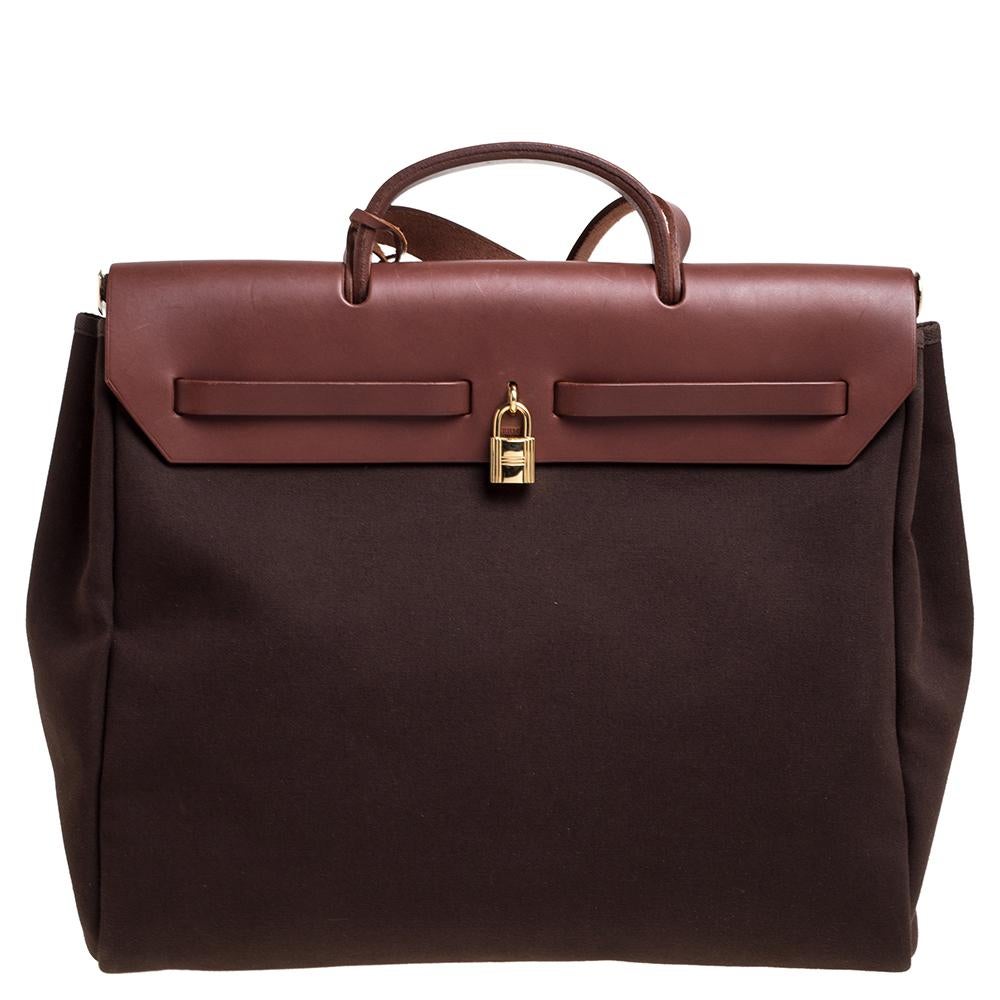 Made from canvas and leather, the Herbag Zip is just as outstanding as all of Hermes' other handbags. First introduced in 2009 as a new version of the Herbag, this piece comes with a single handle, a long shoulder strap and it flaunts fabulous