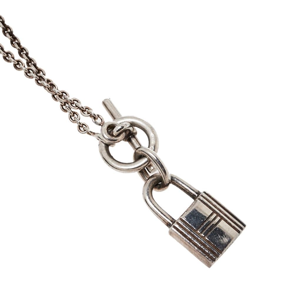 This necklace from Hermes exemplifies minimal style with a smooth toggle chain that holds the brand's signature Kelly padlock. The necklace is crafted from silver to a smooth finish and engraved with the label. We're sure this creation will elevate