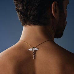 Hermes’ Caduceus Pendant, 18-carat white and yellow gold, emeralds and diamonds