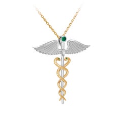 Hermes’ Caduceus Pendant, 18-carat white and yellow gold, emeralds and diamonds