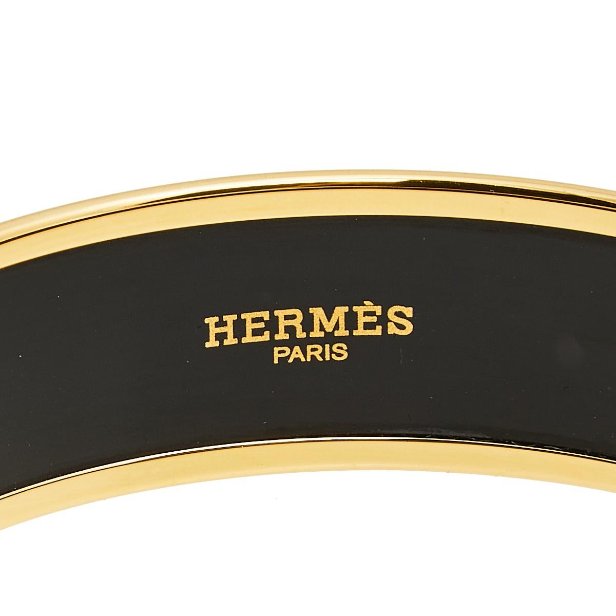 A classic Hermes bangle bracelet is so simple, effortless and yet so chic and luxurious that it is loved my luxury lovers all over the world. Constructed in gold plated metal, this bangle is further enhanced with caleche orange enamel coating all