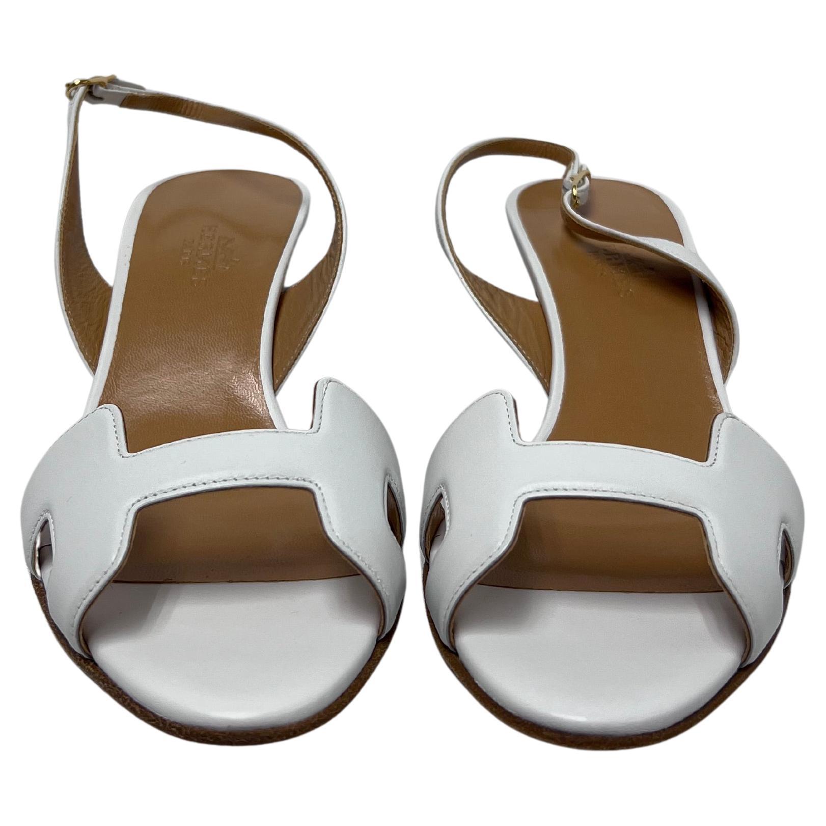 Elegant and effortlessly chic, these Hermès Calfskin Night slingback heels are a must-have for any discerning wardrobe. Crafted from luxurious white calfskin leather, these heels feature a sleek slingback strap for a secure fit and a refined