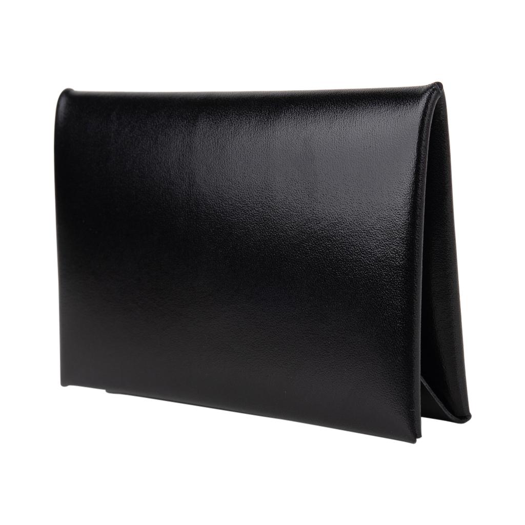 Mightychic offers an Hermes Calvi card holder featured in rare and coveted Box leather in Noir.
Palladium snap closure. 
The card holder has 2 slots for business / credit cards.
Comes with signature Hermes box.
New or Pristine Store Fresh