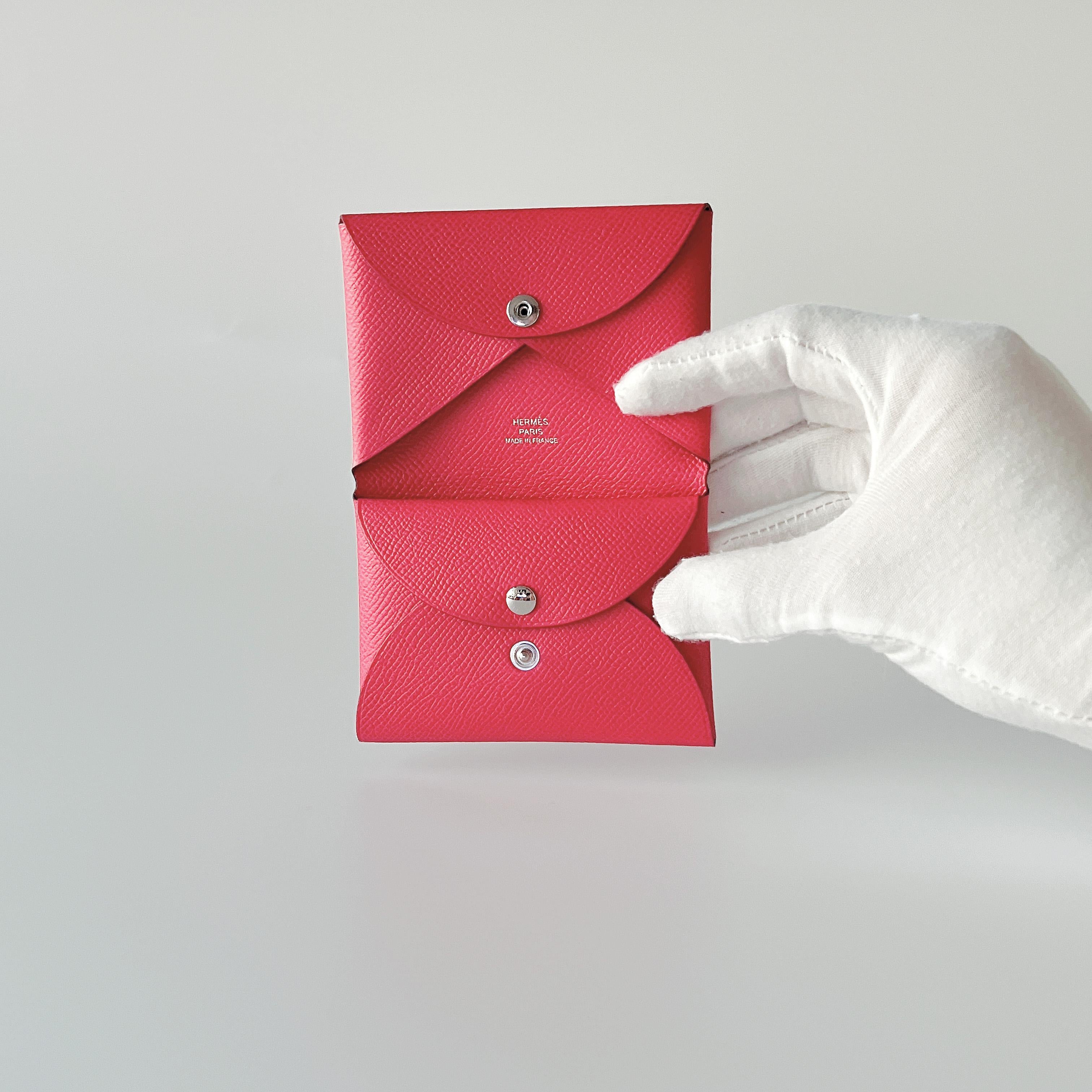 This Hermes Calvi Duo Card Holder in Rose Extreme is made from luxurious Epsom leather, it features a snap closure, 1 credit card slot, and 1 pocket. 

Brand: Hermes

Colour: Rose Extreme

Material: Epsom Leather

Dimensions: L 7 x H 10.5 x D 1.3