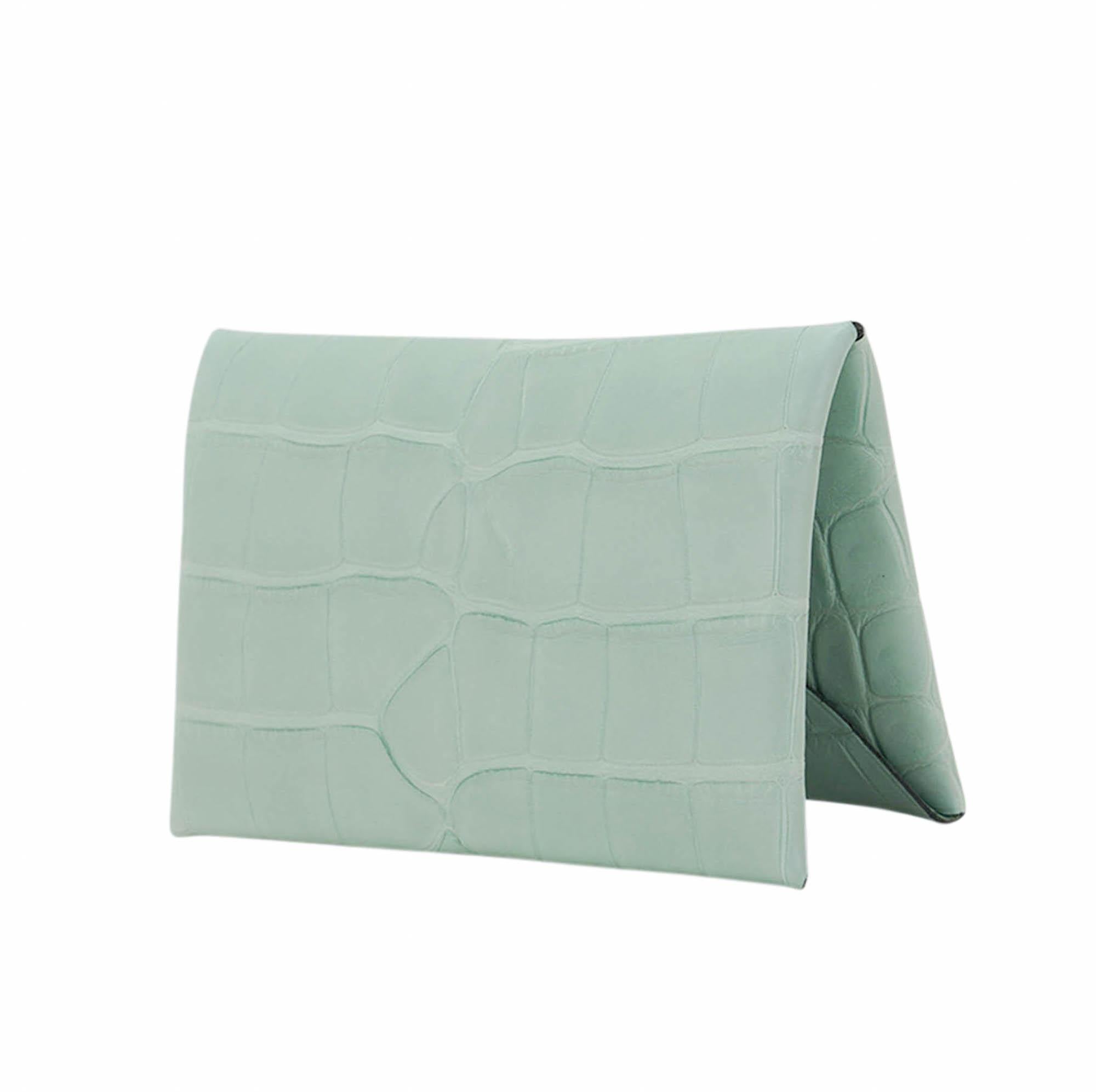 Mightychic offers an Hermes Calvi card holder featured in rare Vert D'Eau Matte Alligator.
Palladium snap closure.
The card holder has 2 slots for business / credit cards.
Comes with signature Hermes box.
New or Store Fresh Condition.
final