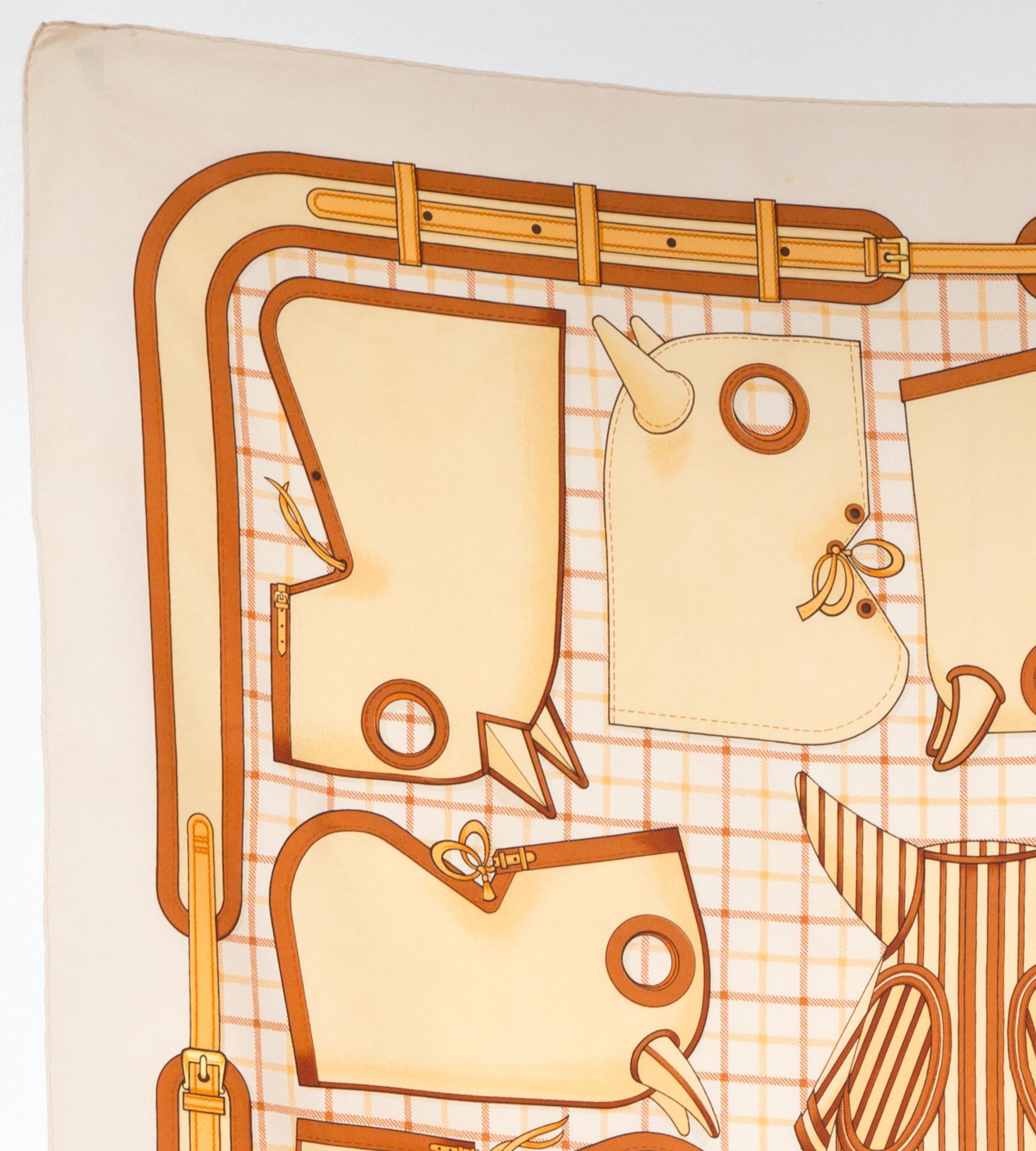 1974 Hermes silk scarf Camails designed by Francoise de la Perriere featuring an ivory border and a Hermès signature. 
Camails was created in 1948.
In good vintage condition. Made in France.
35,4in. (90cm)  X 35,4in. (90cm)
We guarantee you will