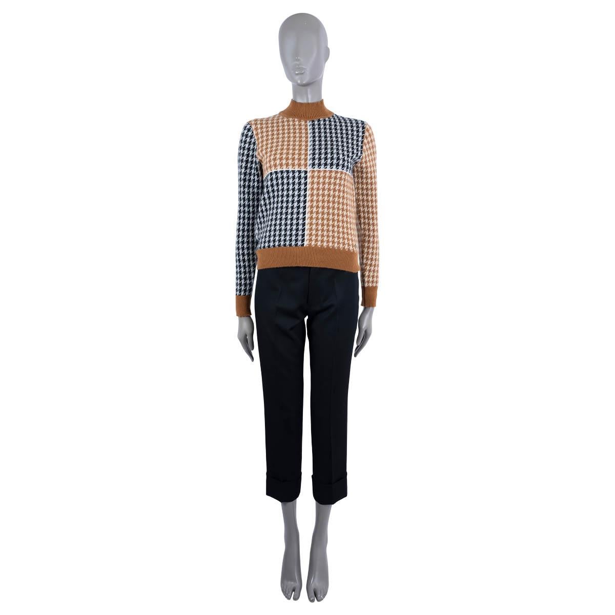 100% authentic Hermès houndstooth sweater in camel brown, beige, ivory, navy blue and grey cashmere (100%). Features a mock neck, hem and cuffs in rib-knit. Has been worn and is in excellent condition.

2019 Fall/Winter

Measurements
Tag