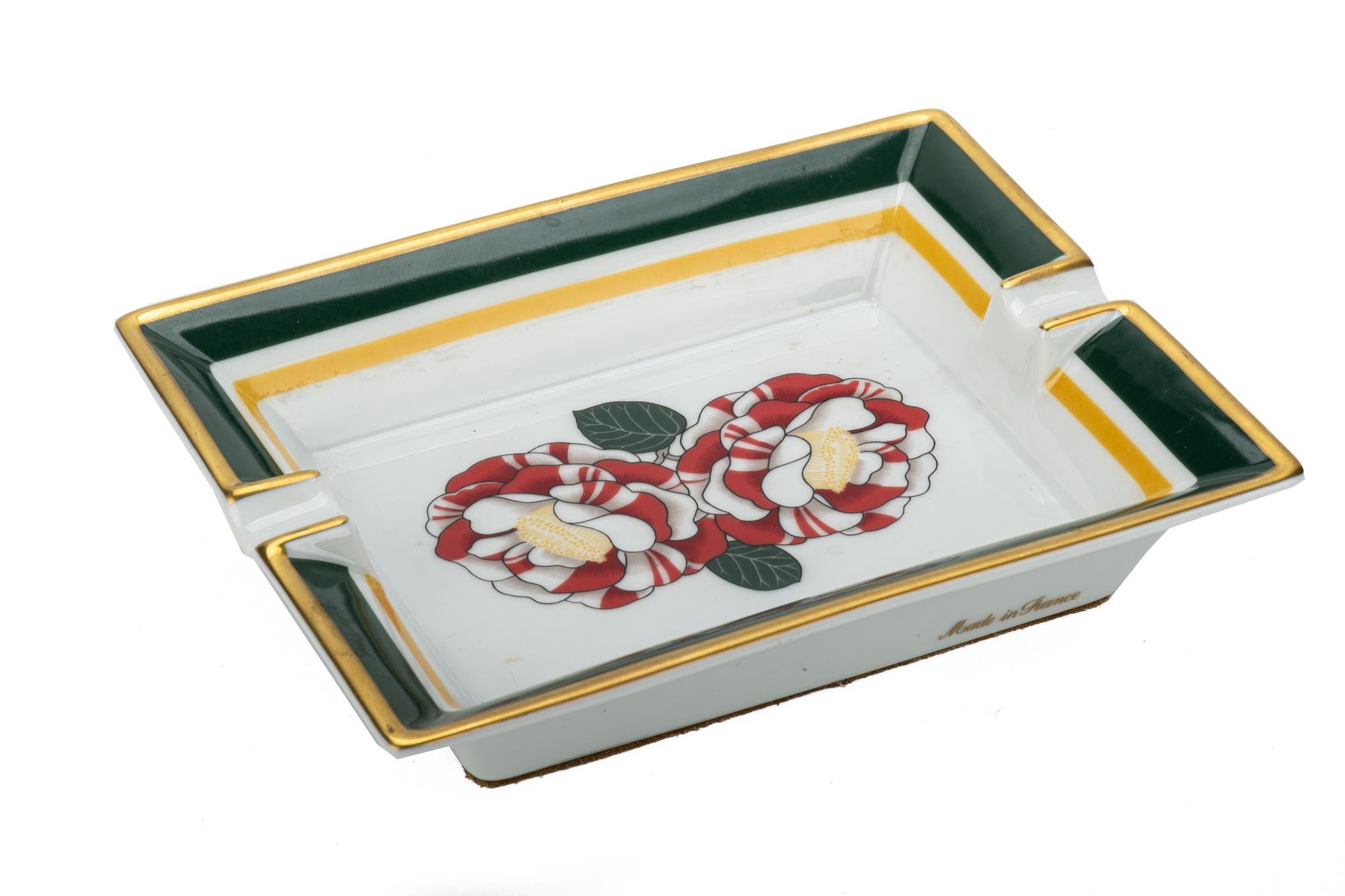 Hermès rectangular camelia design porcelain ashtray. Red, white and green combination. Excellent condition.