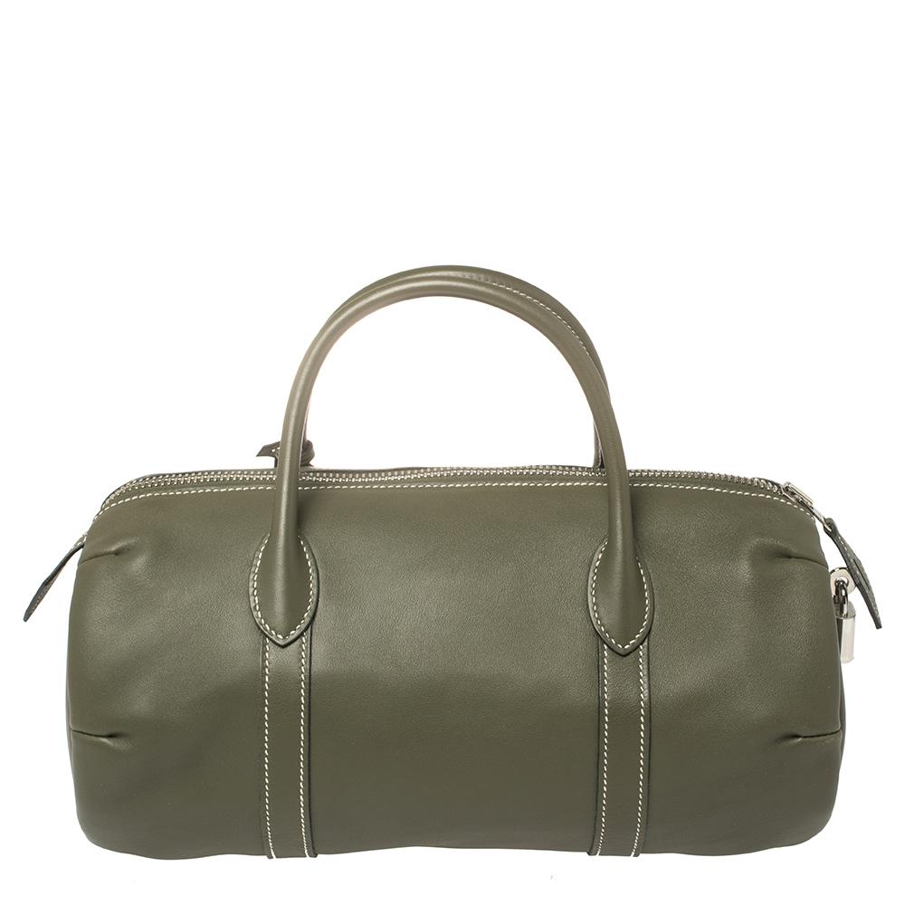 We love anything Hermes, and currently, this Polochon bag has left us smitten! This bag is crafted from leather and it has a cylindrical shape with a top zip closure the secures the leather-lined interior sized to carry your essentials. Complete