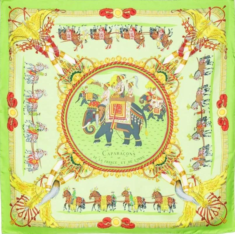 Since its debut in 1937, the Hermès silk scarf, known in French as the carré, has been a persuasive and endearing symbol of luxury. 
Designed in Vert Vif, Vert Anis and Anthracite colourway with processional elephant and horse scenes, this