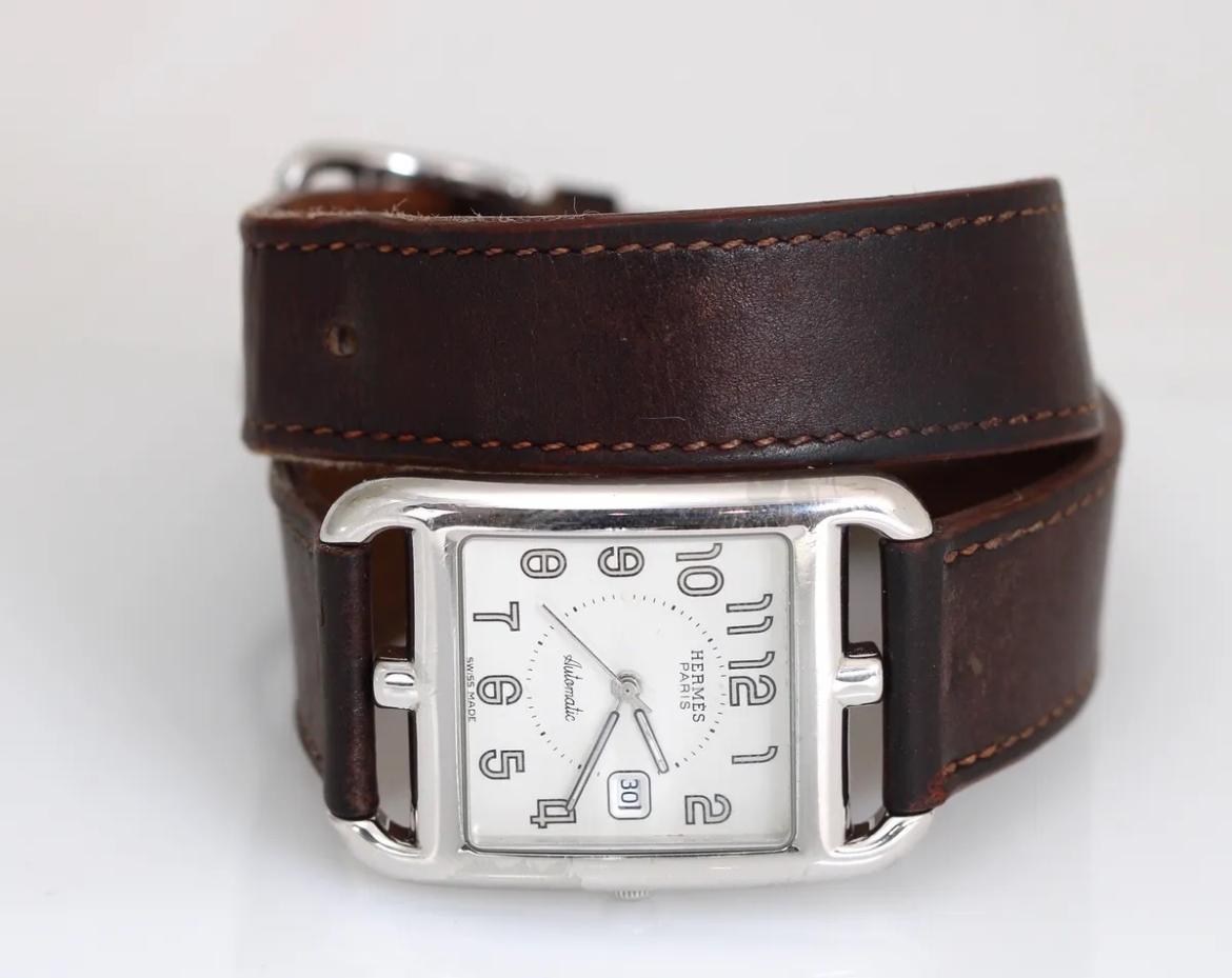 Up for sale is a classic Hermes Cape Cod Double Tour Wristwatch in stainless steel. The case size is on the larger side and is 30mm, making it perfect for both men and women. This watch contains a Swiss Automatic movement. The stainless steel does