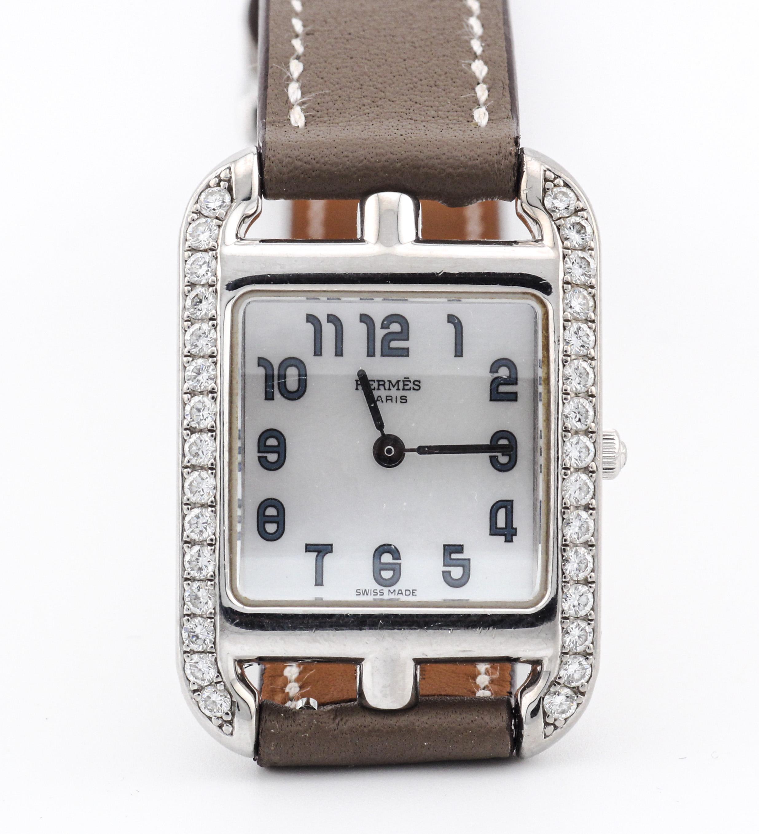 The Hermes Cape Cod Diamond 18K White Gold Wristwatch with a genuine leather strap is a horological masterpiece that seamlessly marries luxury and elegance with the signature style and craftsmanship of the iconic French fashion house, Hermès.

The