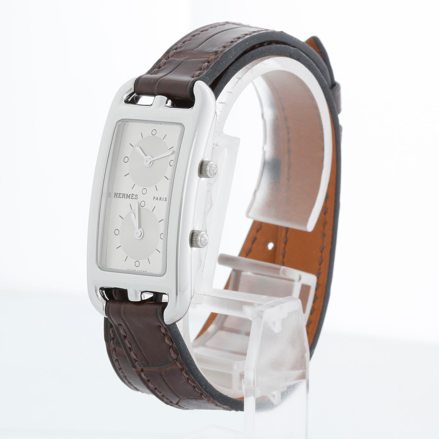 Hermès Cape Cod Dual Time Zone Ladies Stainless Steel Nantucket Watch CC3-210 - Quartz.  Dual time zone. Rectangle case (40mmx20mm). Silver dial with 2 sub dials. Leather double loop strap with Hermes tang buckle. Pre-owned with Hermes box and