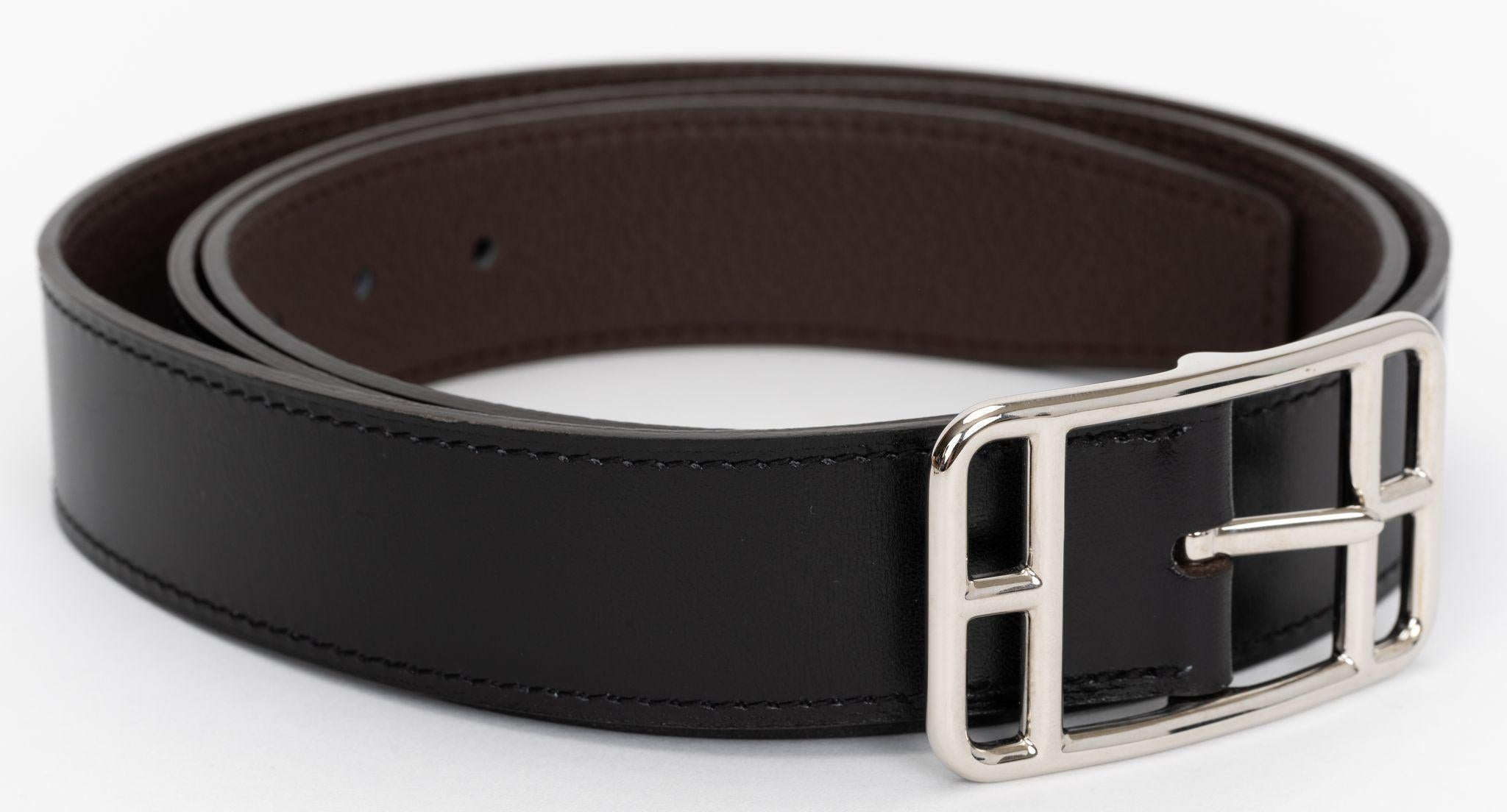 Hermes Cape Cod leather black and brown Belt. The Palladium buckle is an inspiration of Henri D'Origny and it is Unisex. 110 cm Comes with original dust cover.