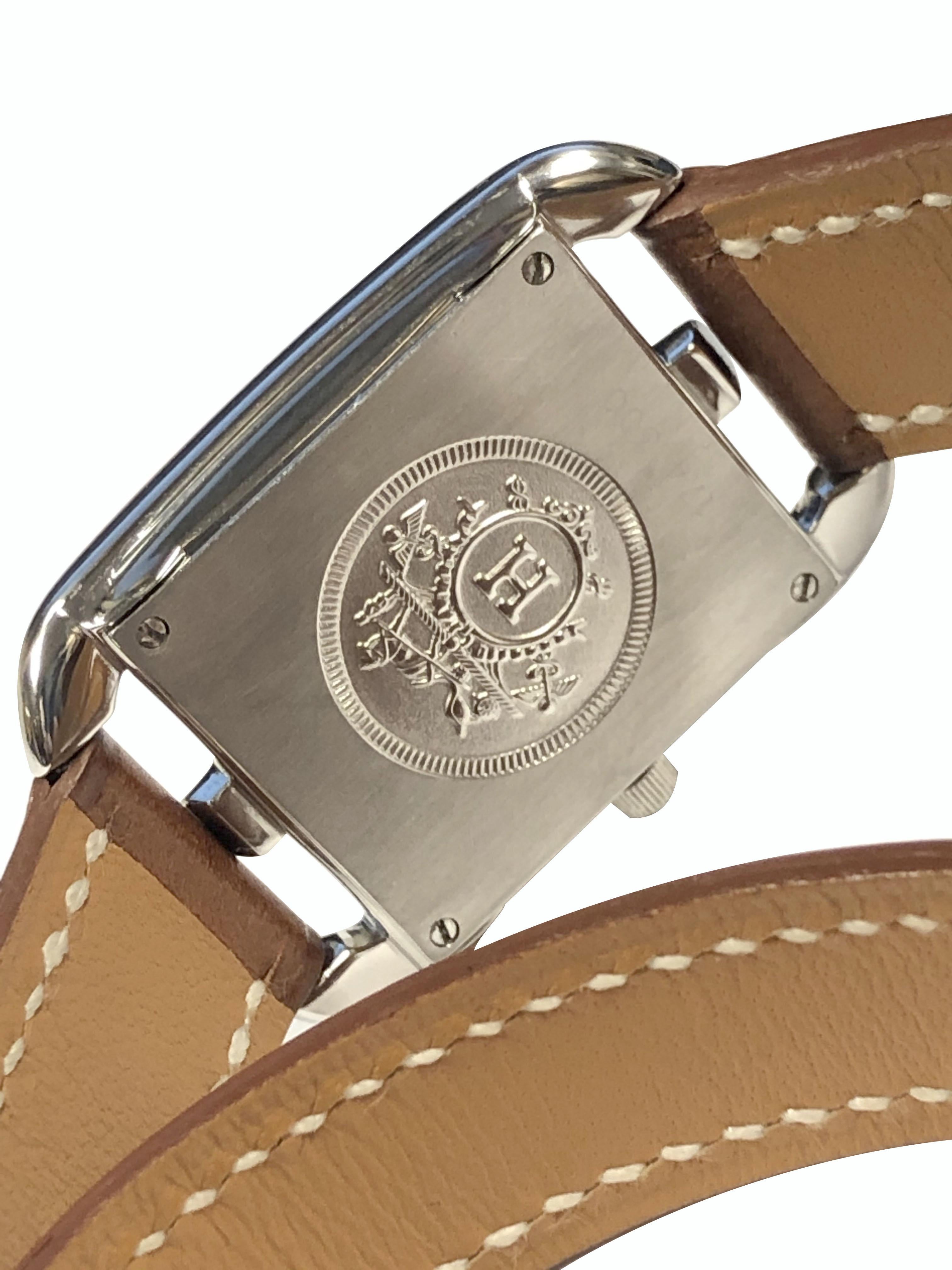 Circa 2015 Hermes Cape Cod Ladies Wrist Watch, 22 X 23 M.M. Stainless Steel 2 piece case, quartz movement, Silver dial with Silver Markers. Light Brown Wrap around Double Tour strap. Recently serviced and comes with a one year warranty. 