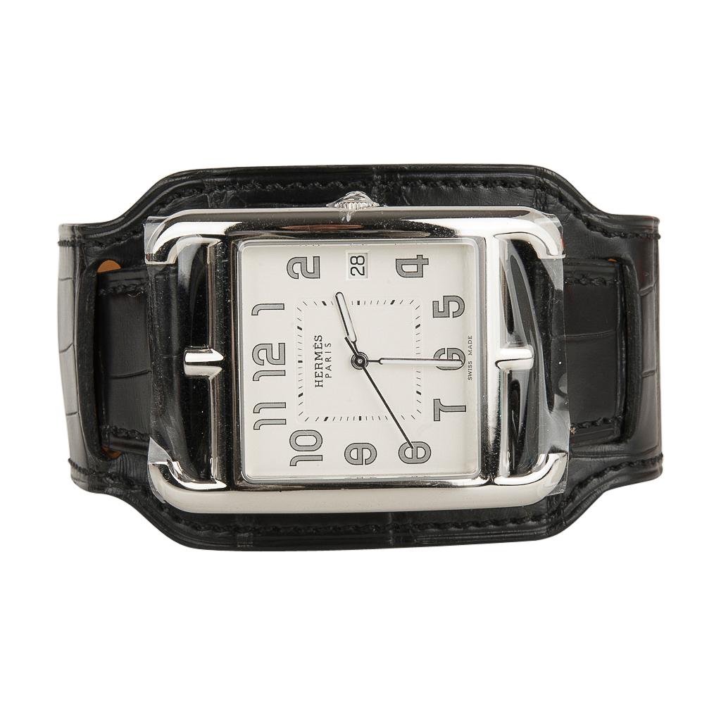 Guaranteed authentic Hermes Cape Cod watch featured with a supple Black matte Alligator cuff strap.
This fabulous limited edition Hermes Cape Cod watch is no longer produced.
Steel and features opaline silvered dial.
Quartz movement.
Made in