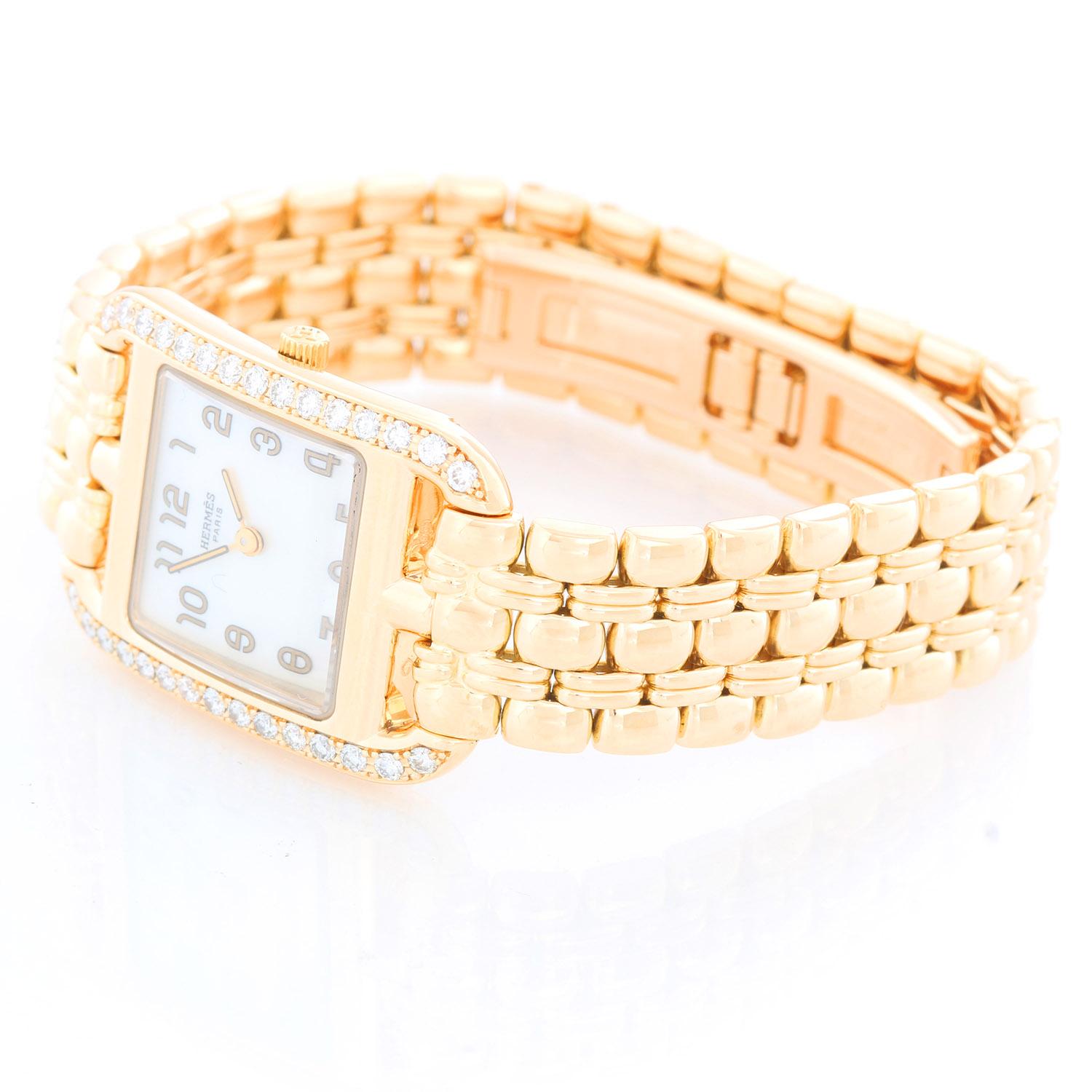 Hermes Cape Cod Yellow Gold Ladies  Watch CC1.288 - Quartz. 18K Yellow gold ( 23 x 23 mm ) with diamond bezel . White mother of pearl watch with Arabic numerals.  18K Yellow gold Hermes bracelet; will fit 6 1/4 inch wrist. Pre-owned with Hermes box