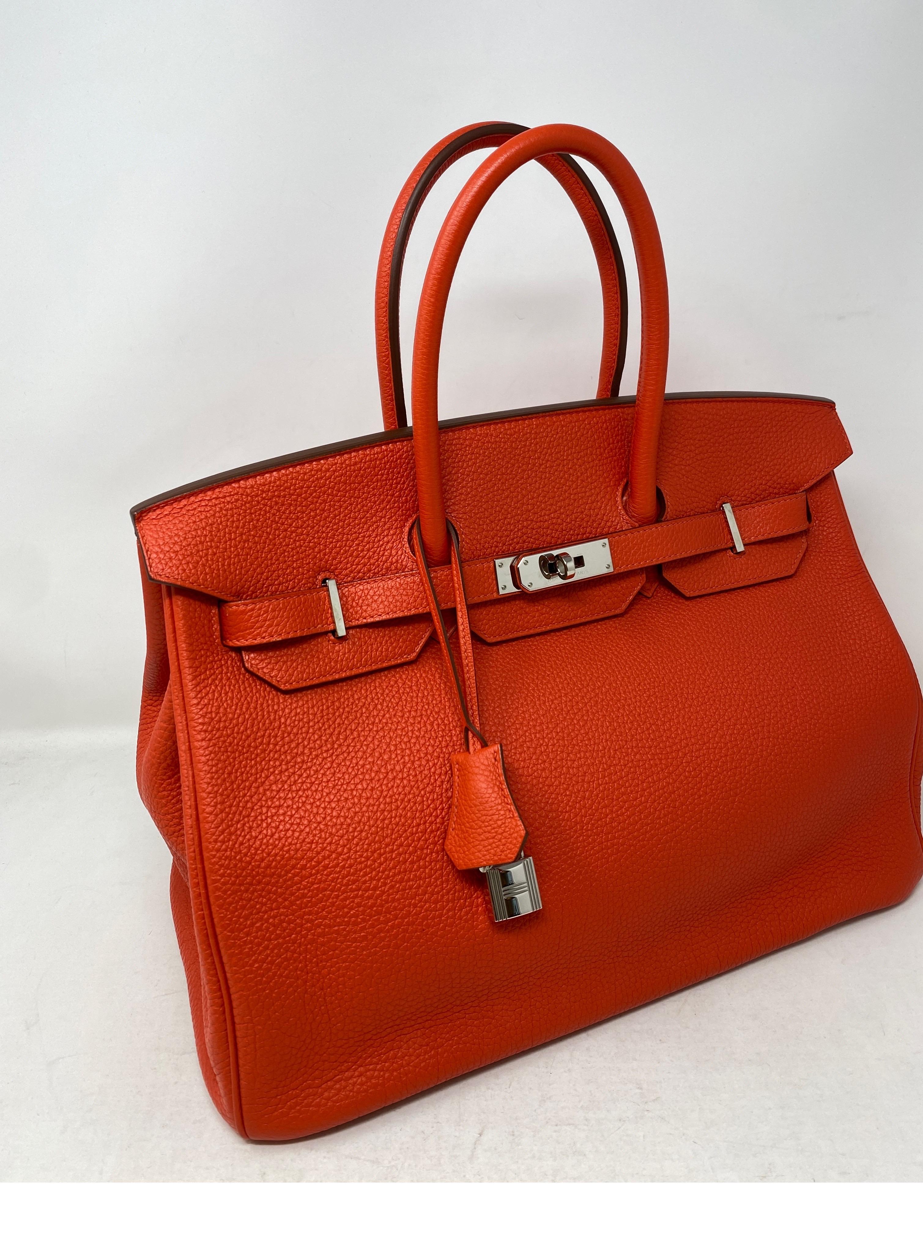 Hermes Capucine Orange Birkin 35 Bag. Excellent like new condition. Gorgeous bright orange/red color. Togo leather. Palladium hardware. Beautiful Birkin Bag. Includes clochette, lock, keys, and dust cover. Guaranteed authentic. 