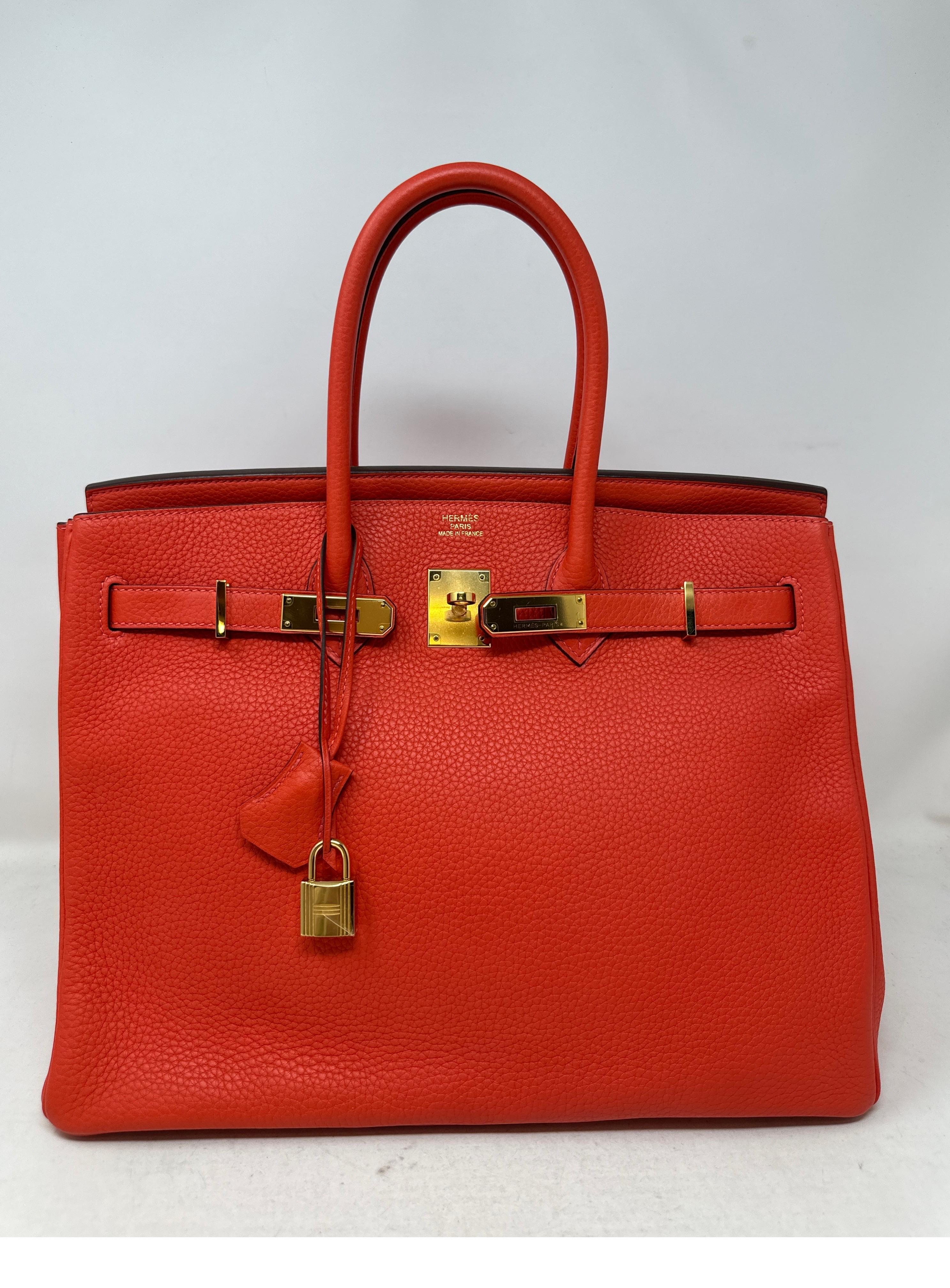 Hermes Capucine Birkin 35 Bag. Bright orange red color with gold hardware. Poppy color. Looks like new. Excellent condition. Plastic is still on the hardware. Big bags are coming back. Don't miss out on a great deal. Interior clean. Includes