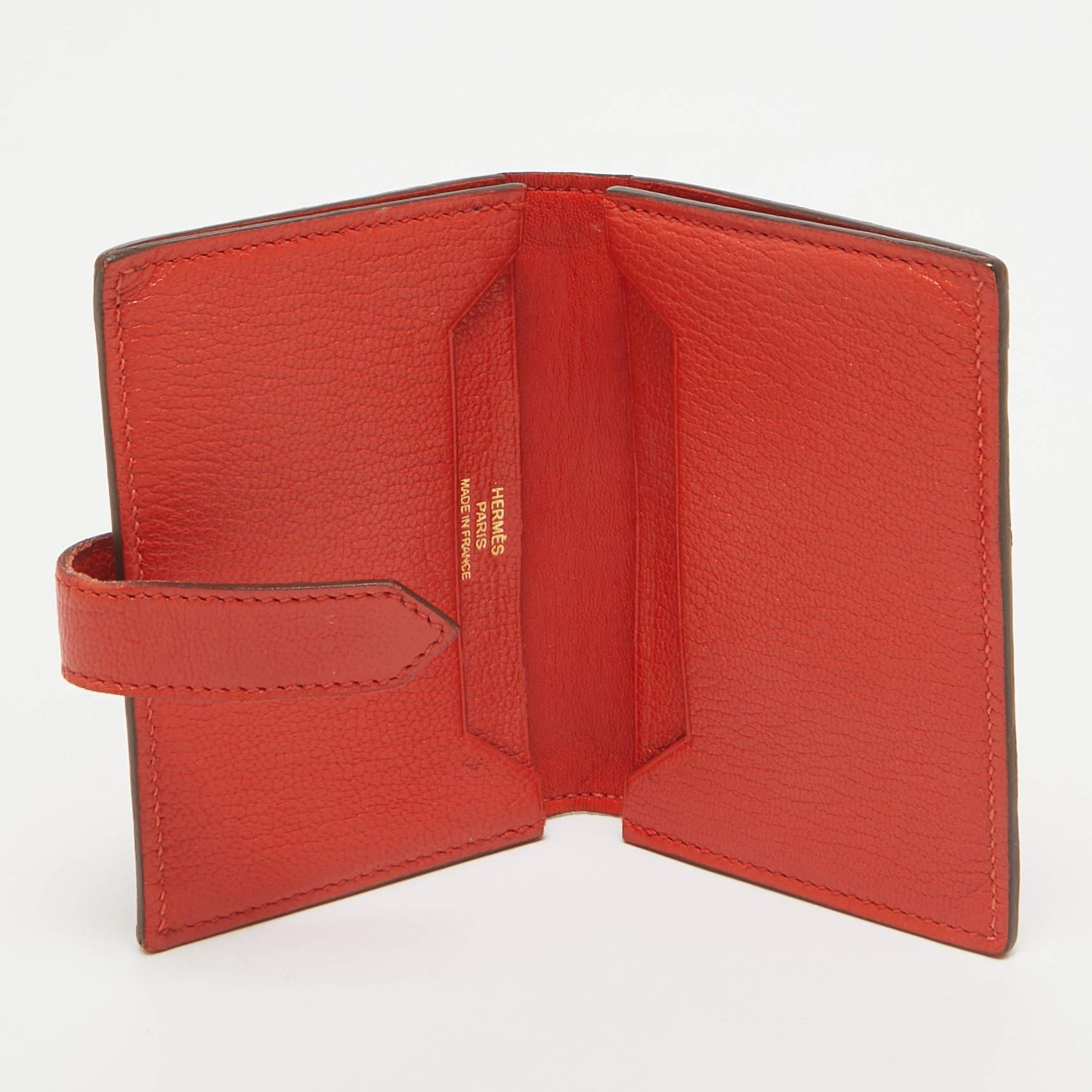 HermÃ¨s yet again charms us with this stunner of a creation that looks quite chic and stylish This pretty Bearn card holder is crafted from leather and features a front tuck in strap closure with a gold tone H buckle. It opens to a leather lined