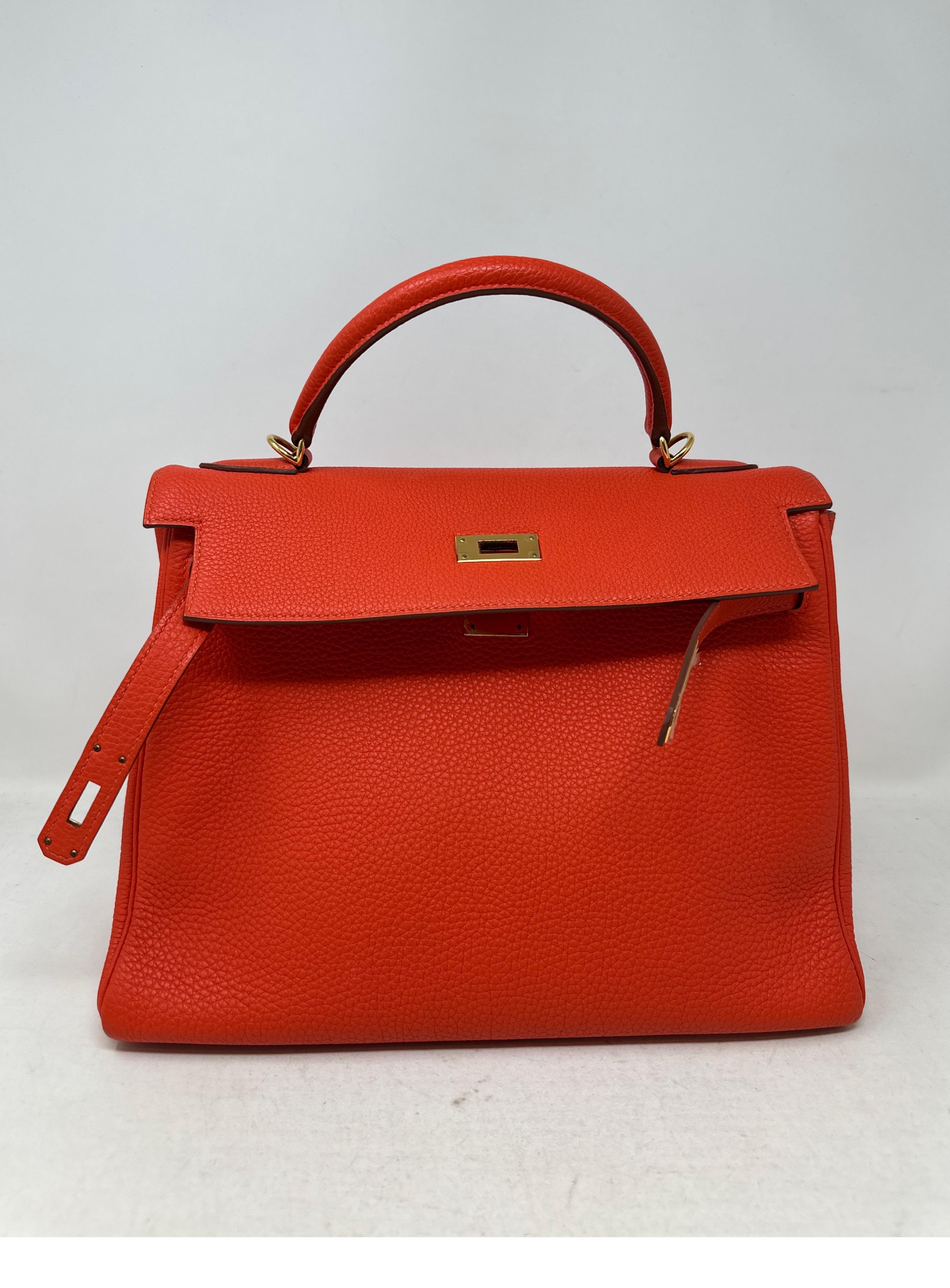 Hermes Capucine Kelly 32 Bag. Gorgeous poppy orange red color. Looks like new. Excellent condition. Togo leather. Gold hardware. Very vibrant color that pops. Kelly are high in demand now. Interior is so clean. Looks like it was never used. Includes
