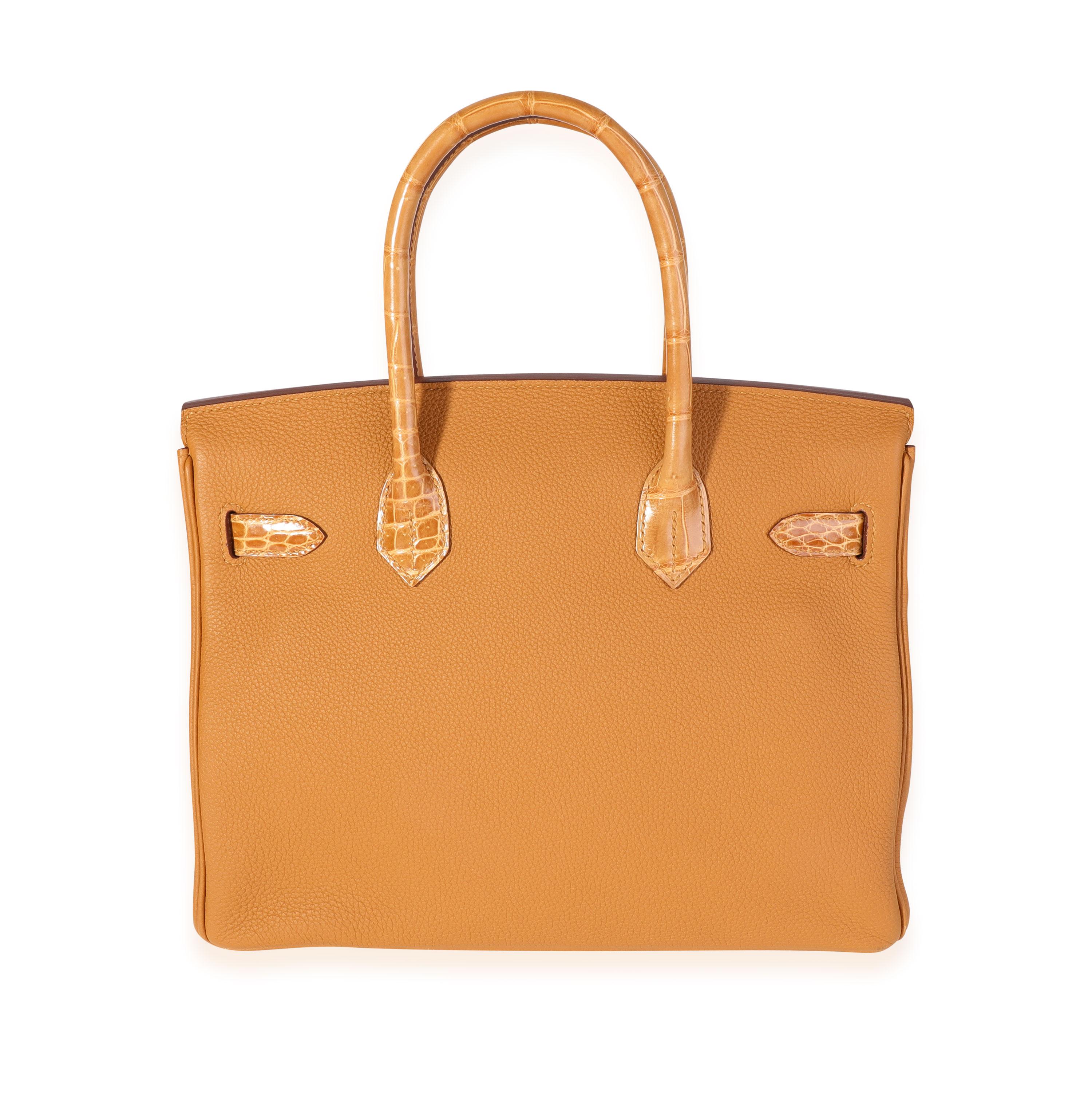Listing Title: Hermès Caramel Tabac Shiny Niloticus Crocodile & Togo Touch Birkin 30 GHW
SKU: 119830
Condition: Pre-owned (3000)
Handbag Condition: Very Good
Condition Comments: Very Good Condition. Plastic on hardware. Scuffing and discoloration to