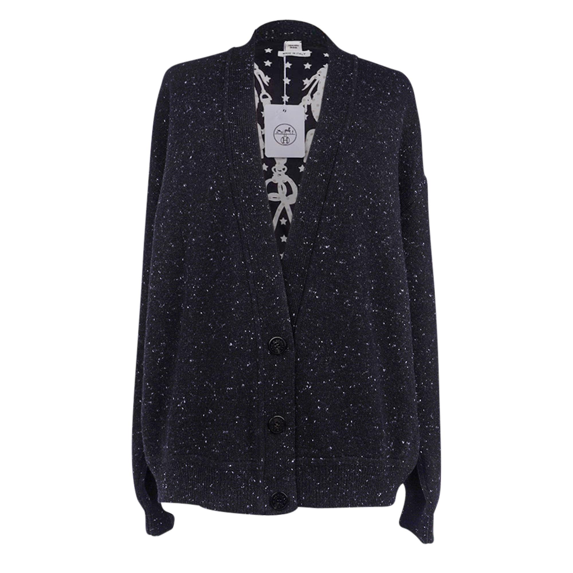 Mightychic offers a guaranteed authentic Hermes Brides de Gala twillaine V neck cashmere tweed cardigan in Black, White and Gray.
Rear depicts the Brides de Gala in silk, the most popular and recognizable scarf print Hermes has made -