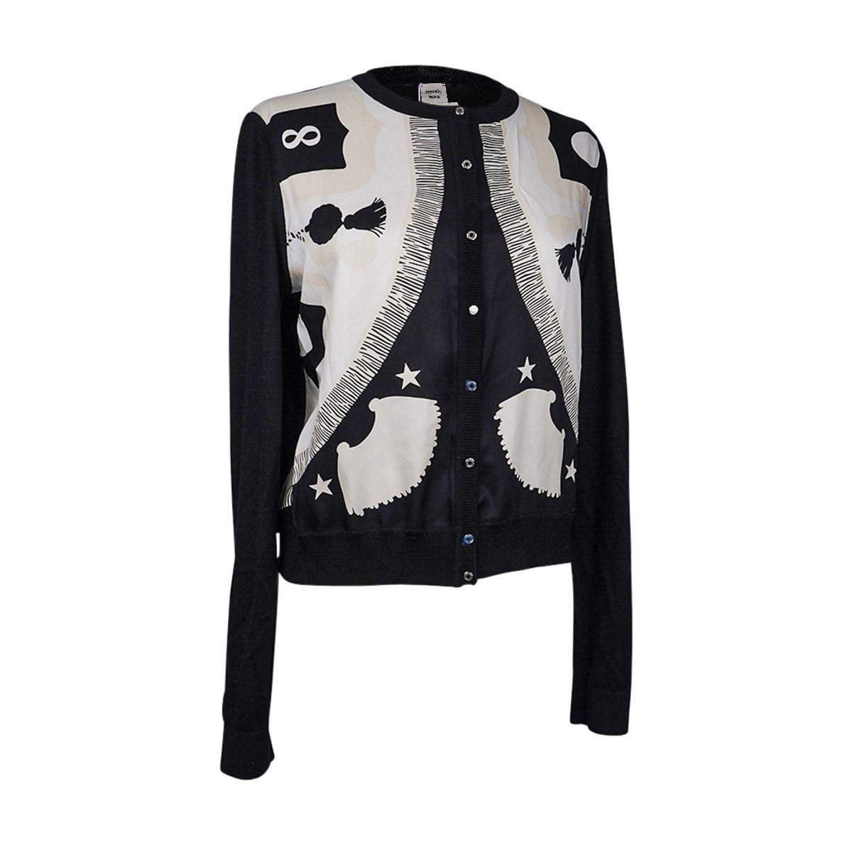 Mightychic offers an Hermes Poste et Cavalerie silk print Court twillaine cashmere cardigan.
Black and silk scarf print front has touches of nude beige.
8 small palladium plated clou de selle buttons.
Ribbing at sleeve and hip.
Sleeves and rear are