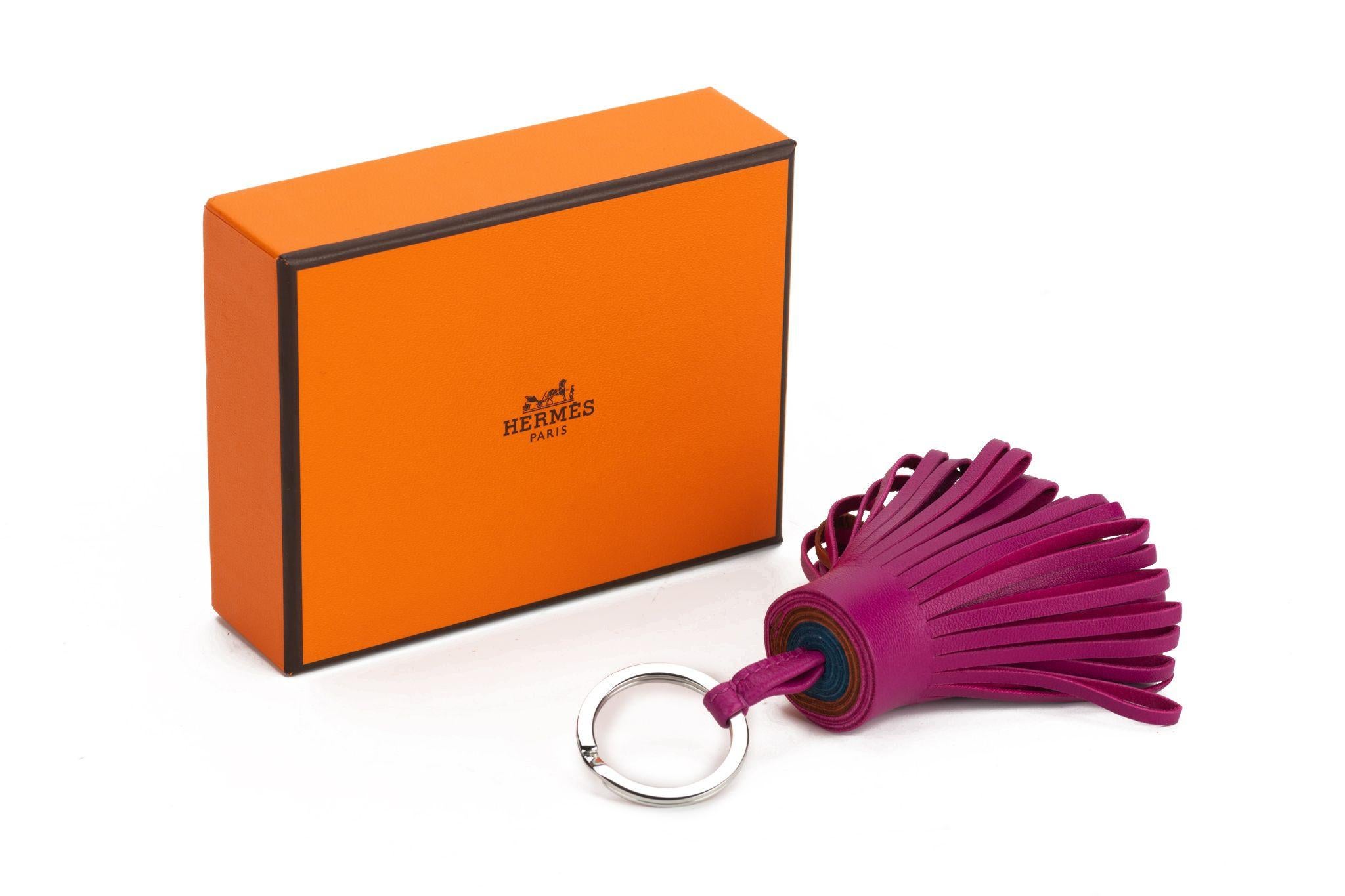 Hermès Carmen Key Ring. Tricolor key ring in Milo lambskin with stainless steel hardware. The item is new and comes with the original box.