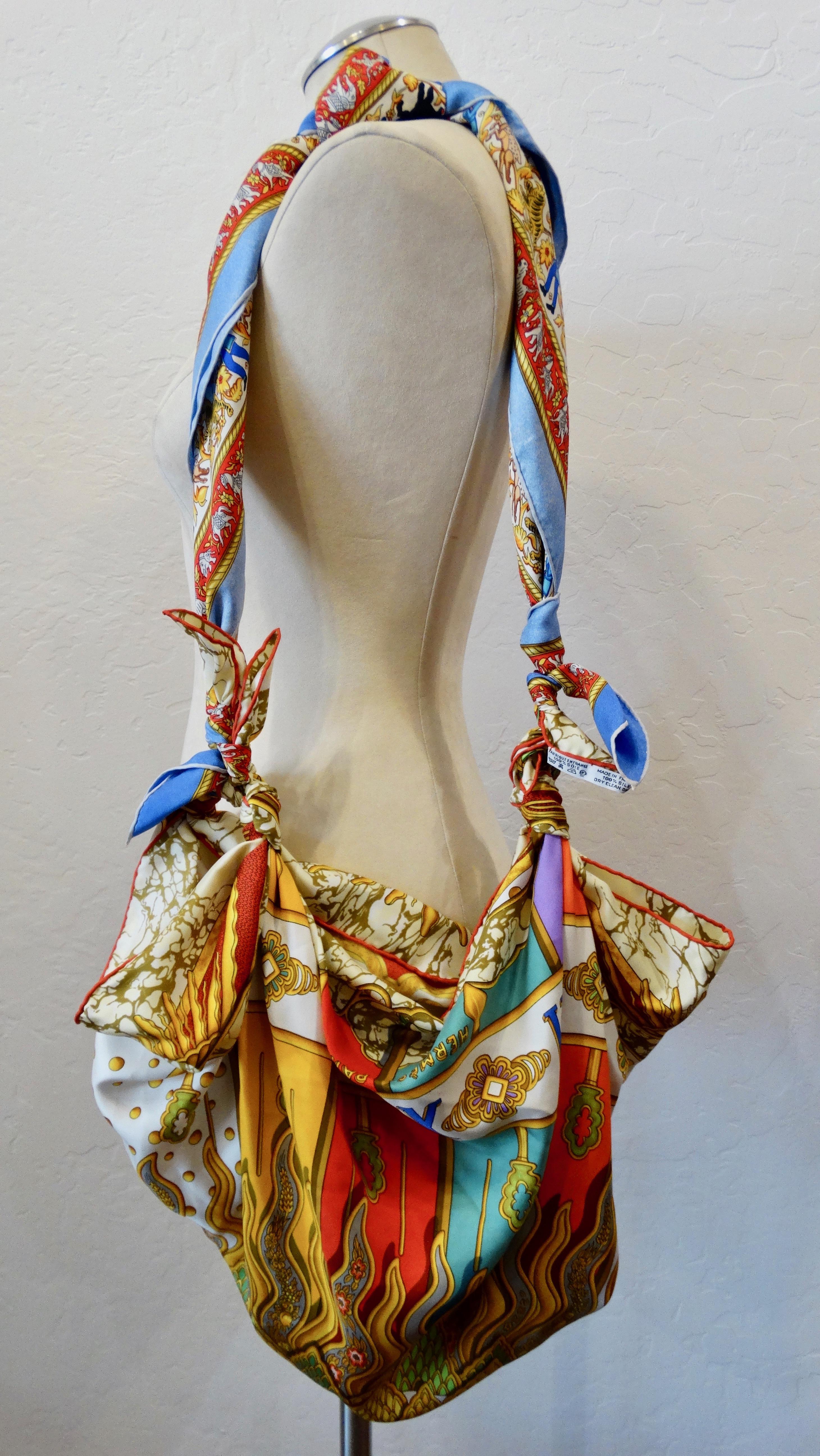Hello Hermes! Elevate your whole entire bag collection with this amazing Hermes scarf bag! Featured as the bag is the beautiful 1994 Carpe Diem scarf designed by Joachim Metz. Includes a vibrant array of colors and a large mystic astrology sun. The