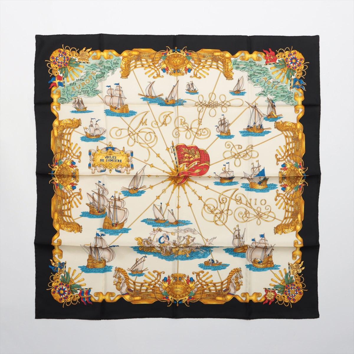 The Hermès Carré Voiles De Lumière Silk Scarf in White and Black is a timeless and elegant accessory that showcases the brand's renowned craftsmanship and artistic design. Made from 100% silk, the carré features the 