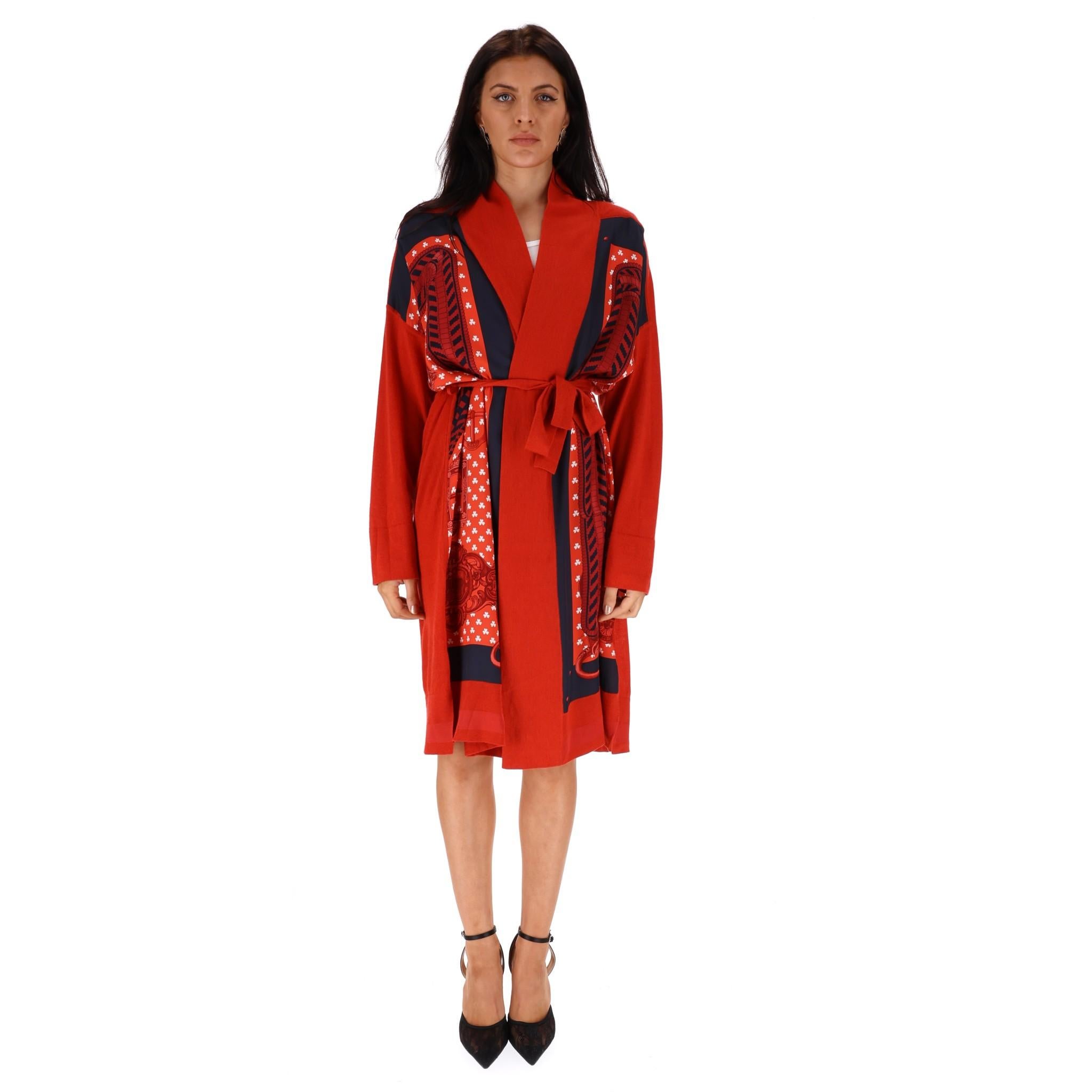 Hermes Cashmere & Silk Cardi/Coat - Twillaine Boucles Et Galons Du Tsa 

Belted, red fine knitted cardigan with scarf printed silk panel to the front, flap

detailing to shoulders at the back, knee length. 

Size - 38FR

Condition