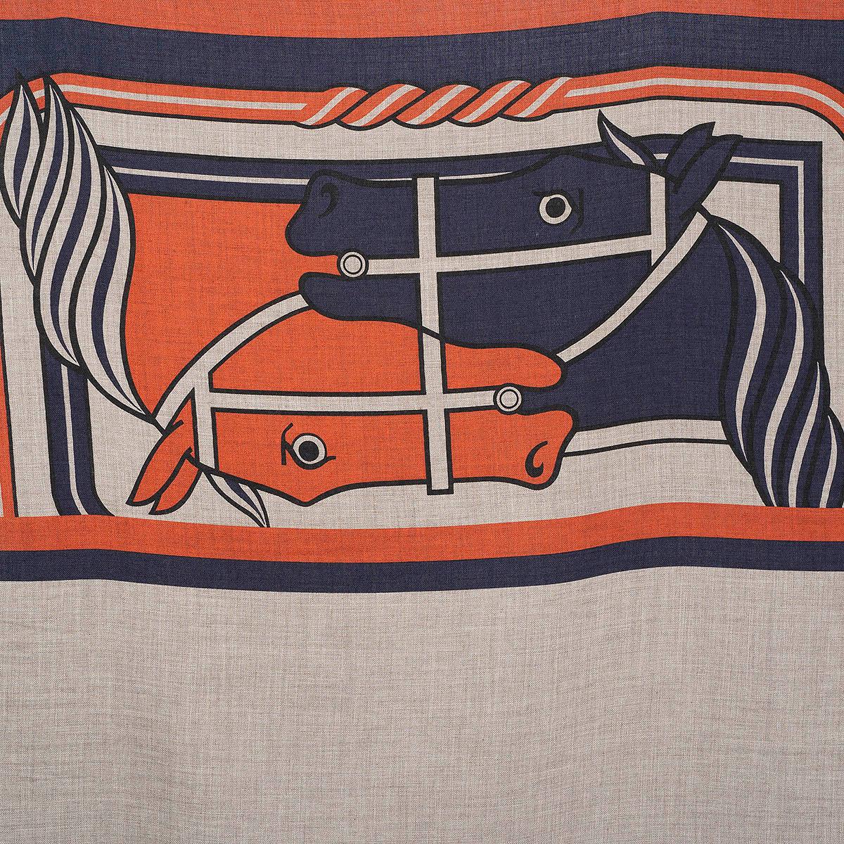100% authentic Hermès Quadrige II shawl by Pierre Péron in taupe cashmere (70%) and silk (30%) with navy blue and rust details. Finished with hand-rolled and fringed edges. Brand new.

Measurements
Width	90cm (35.1in)
Length	180cm (70.2in)

All our