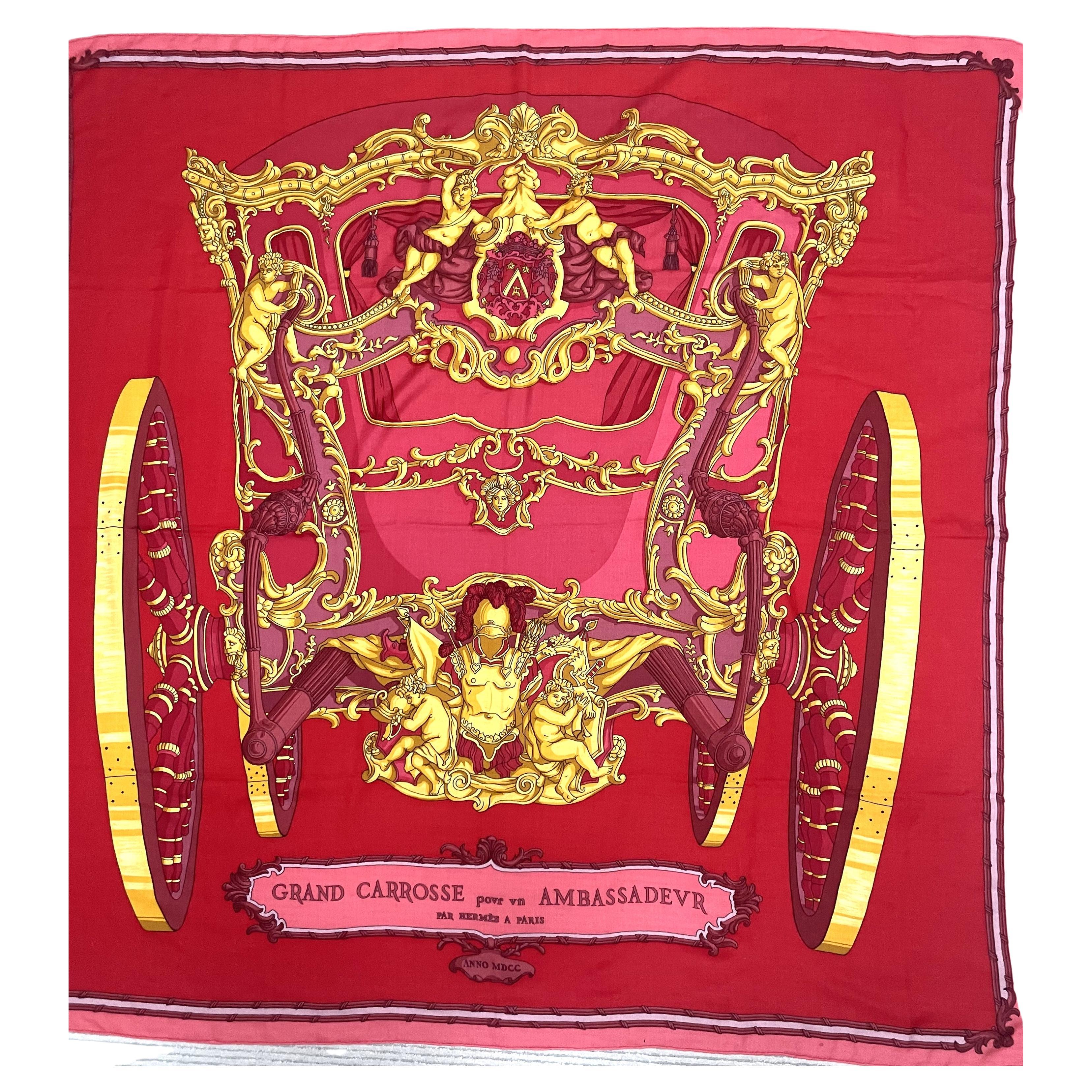Very beautiful decorative 130 cm x 130 cm scarf made of 65% cashmere and 35% silk in the colors red, yellow and pink.

The theme of the large Hermes Shawel  is:
'GRAND CARROSSE pour AMBASSADEUR par HERMES A PARIS' ANNO MDCC'

Measurement 130cm x 130