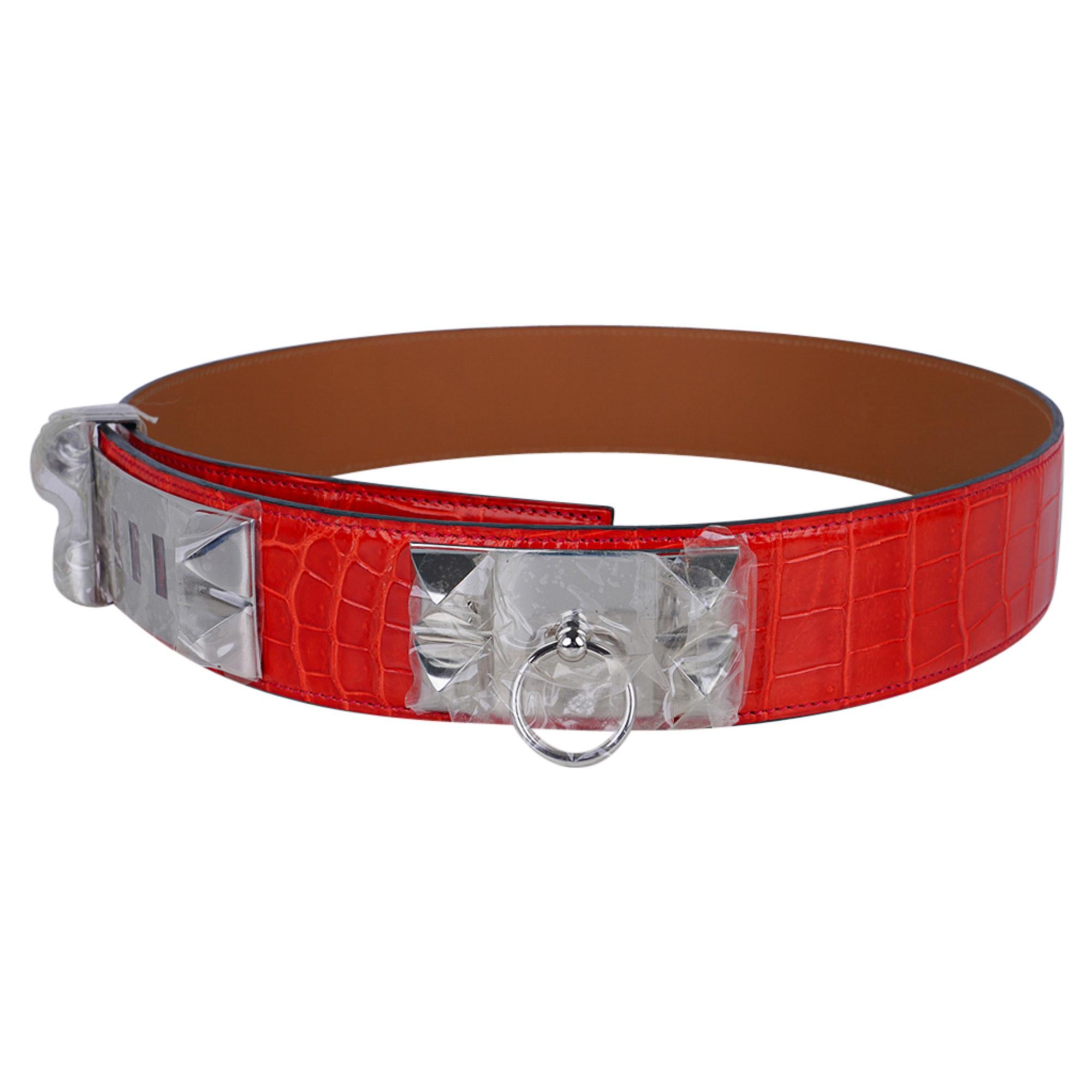 Mightychic offers an Hermes Collier de Chien CDC belt featured in Geranium Porosus Crocodile.
Crisp with Palladium hardware.
The iconic Collier de Chien belt has been retired, and is now making a comeback.
HERMES PARIS MADE IN FRANCE is stamped on