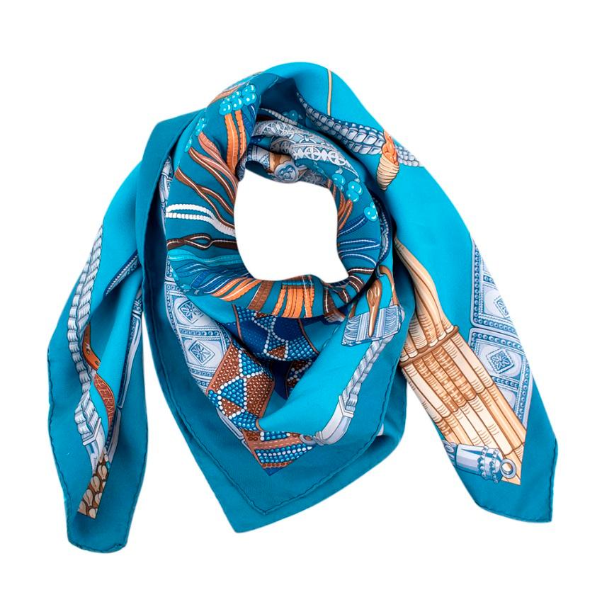 Hermes Silk Ceinture et Liens Blue and Orange Scarf

- Luminus Palette 
- Pattern of Ethnic Belts Collected From Regions Across Asia and Africa
- 'H' in Centre 

Material:
-100% Silk 

Width: 89cm
Length: 89cm